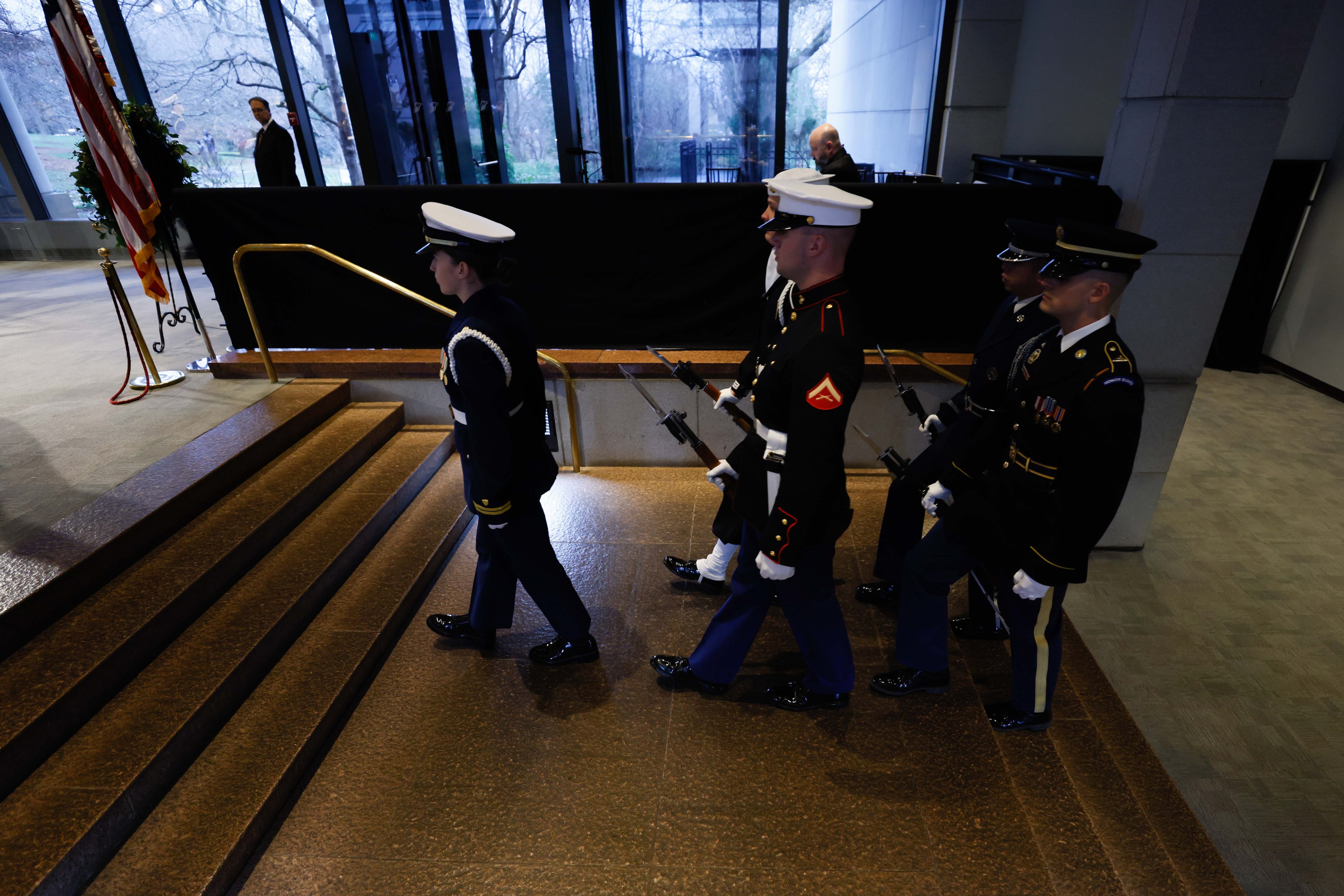 The Honor Guard walks for a shift change on Monday, January 6, 2025, as former President Jimmy Carter lies in repose at the Jimmy Carter Presidential Library and Museum in Atlanta. Carter died peacefully at 100 in Plains, Georgia, on December 29, 2024.
(Miguel Martinez/AJC)