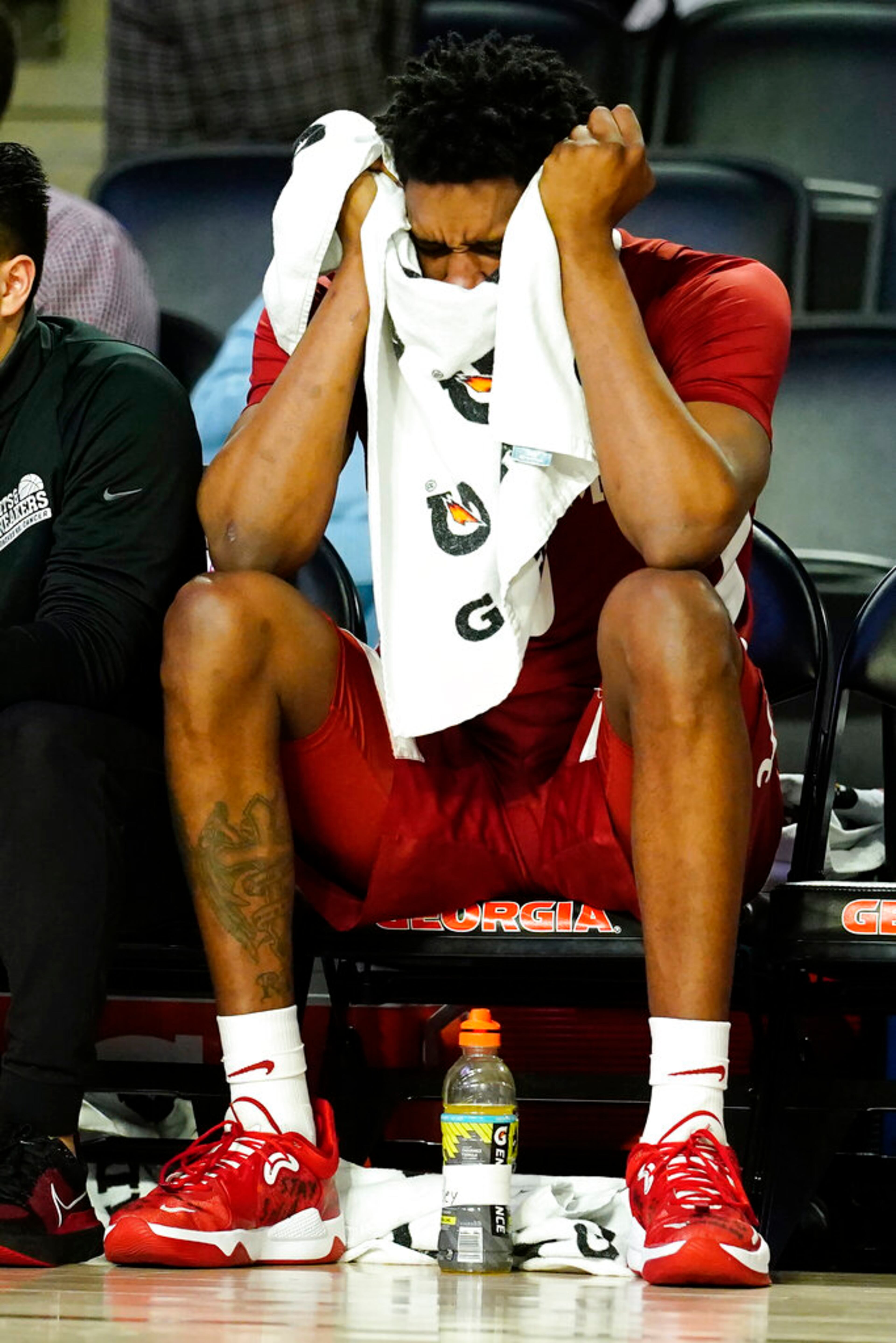 Alabama forward Noah Gurley (0) sits on the bench in the finals minutes of their loss to Georgia in an NCAA college basketball game Tuesday, Jan. 25, 2022, in Athens, Ga. (AP Photo/John Bazemore)
