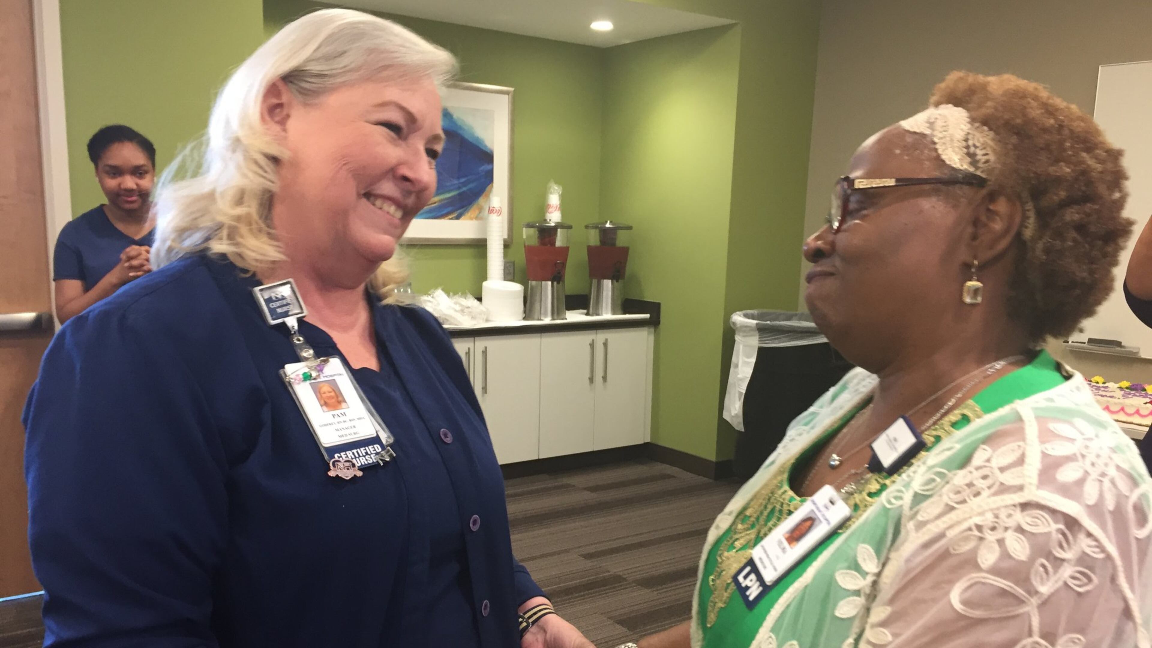 Pam Godfrey (left) tells Velma Blackwell how much she will be missed as part of the Northside Hospital Cherokee nursing team. Blackwell recently retired after more than 40 years at the hospital. CONTRIBUTED BY DANA JOHNSON