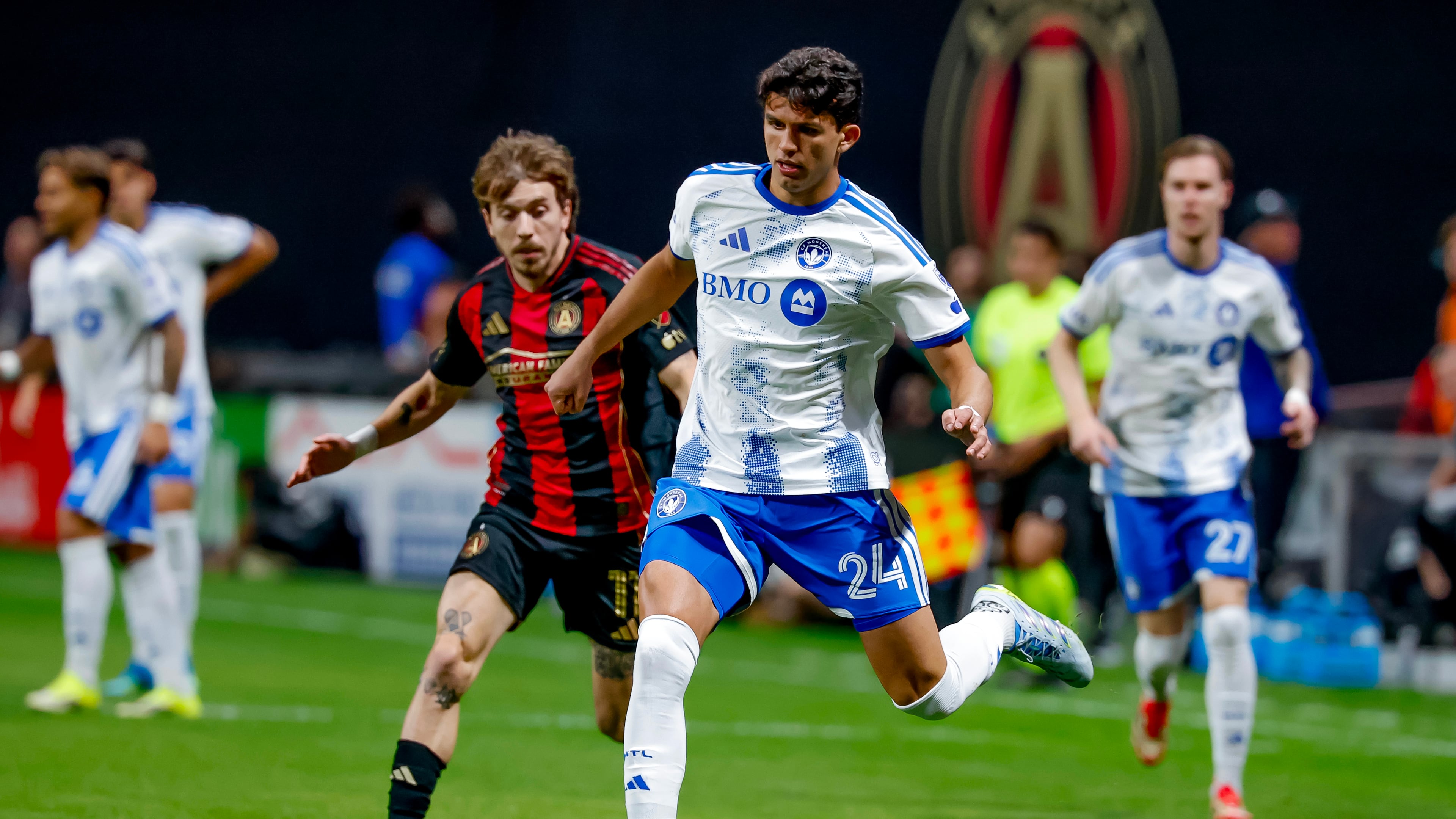 CF Montreal defender Efrain Morales (24) controls the ball against Atlanta United forward Saba Lobjanidze, center left, during the first half of an MLS soccer match, Saturday, May 2, 2026, in Atlanta. (AP Photo/Erik S. Lesser)
