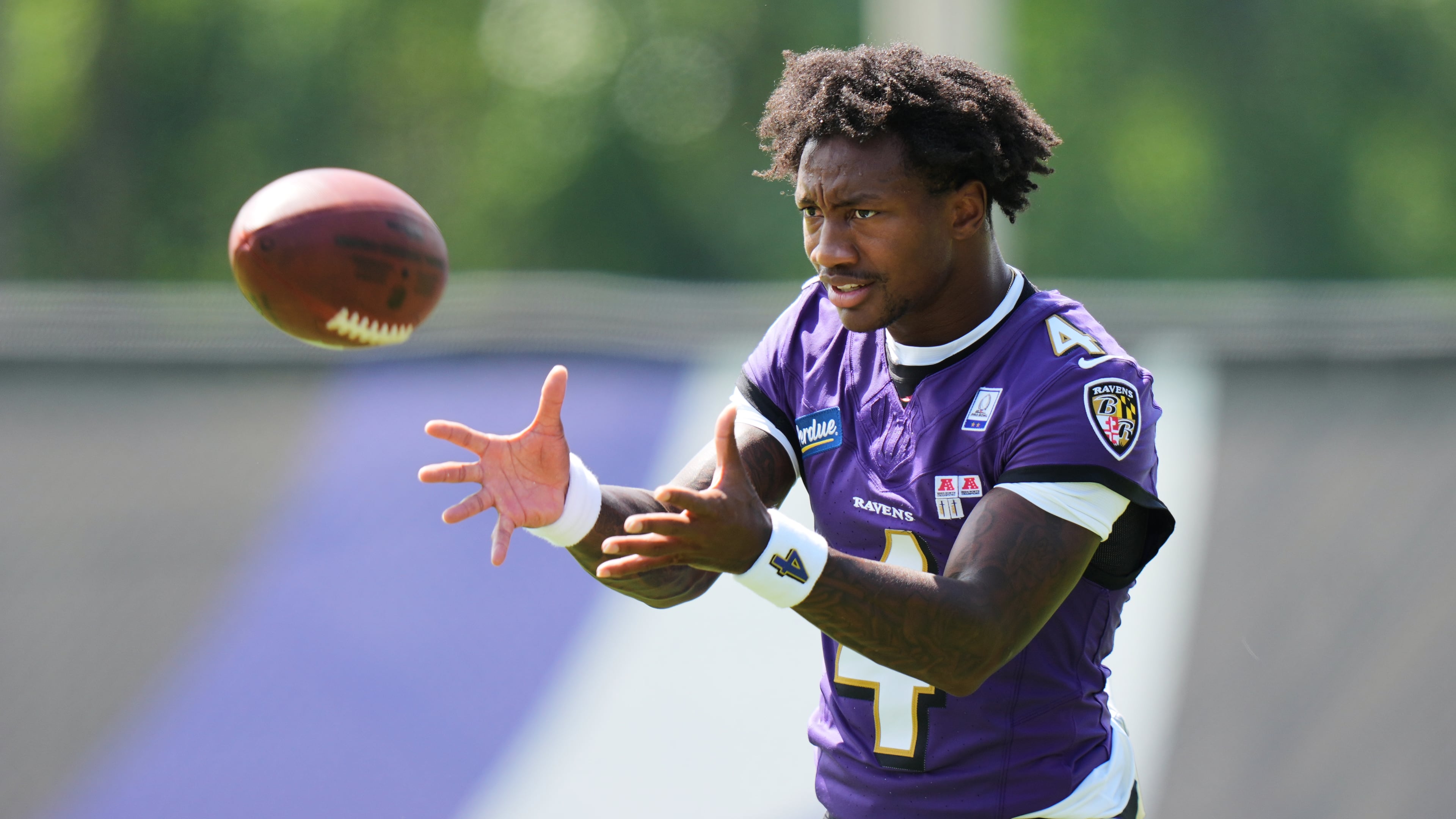 Baltimore Ravens wide receiver Zay Flowers (4) works out during practice at the team's NFL football training camp, Wednesday, July 29, 2026, at the Under Armour Performance Center in Owings Mills, Md. (AP Photo/Stephanie Scarbrough)