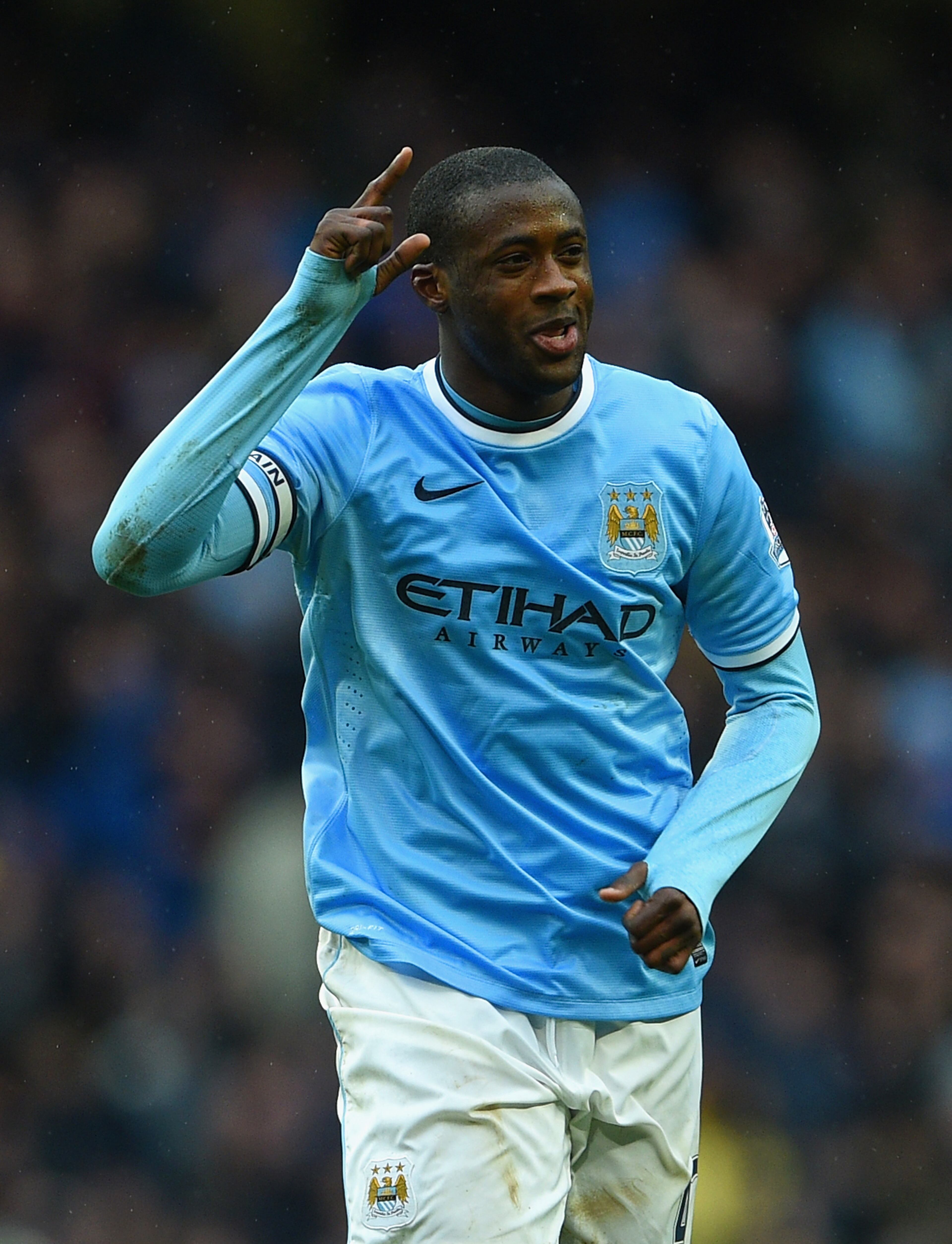 MANCHESTER, ENGLAND - MARCH 22: Yaya Toure of Manchester City celebrates scoring his hat trick during the Barclays Premier League match between Manchester City and Fulham at Etihad Stadium on March 22, 2014 in Manchester, England. (Photo by Michael Regan/Getty Images)
