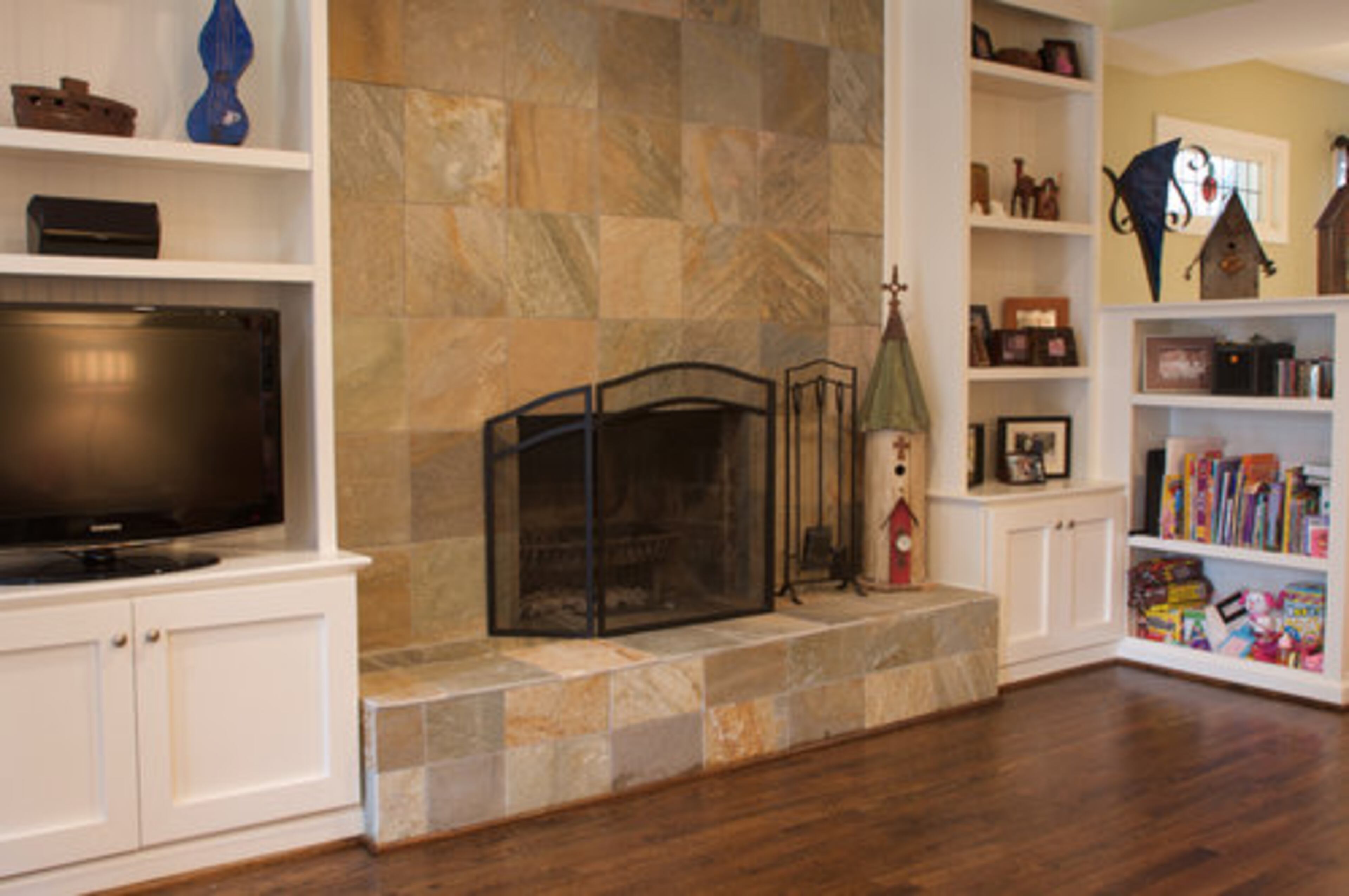 The wood-burning fireplace was part of the original design of the home. The newly added slats gives it an updated twist.