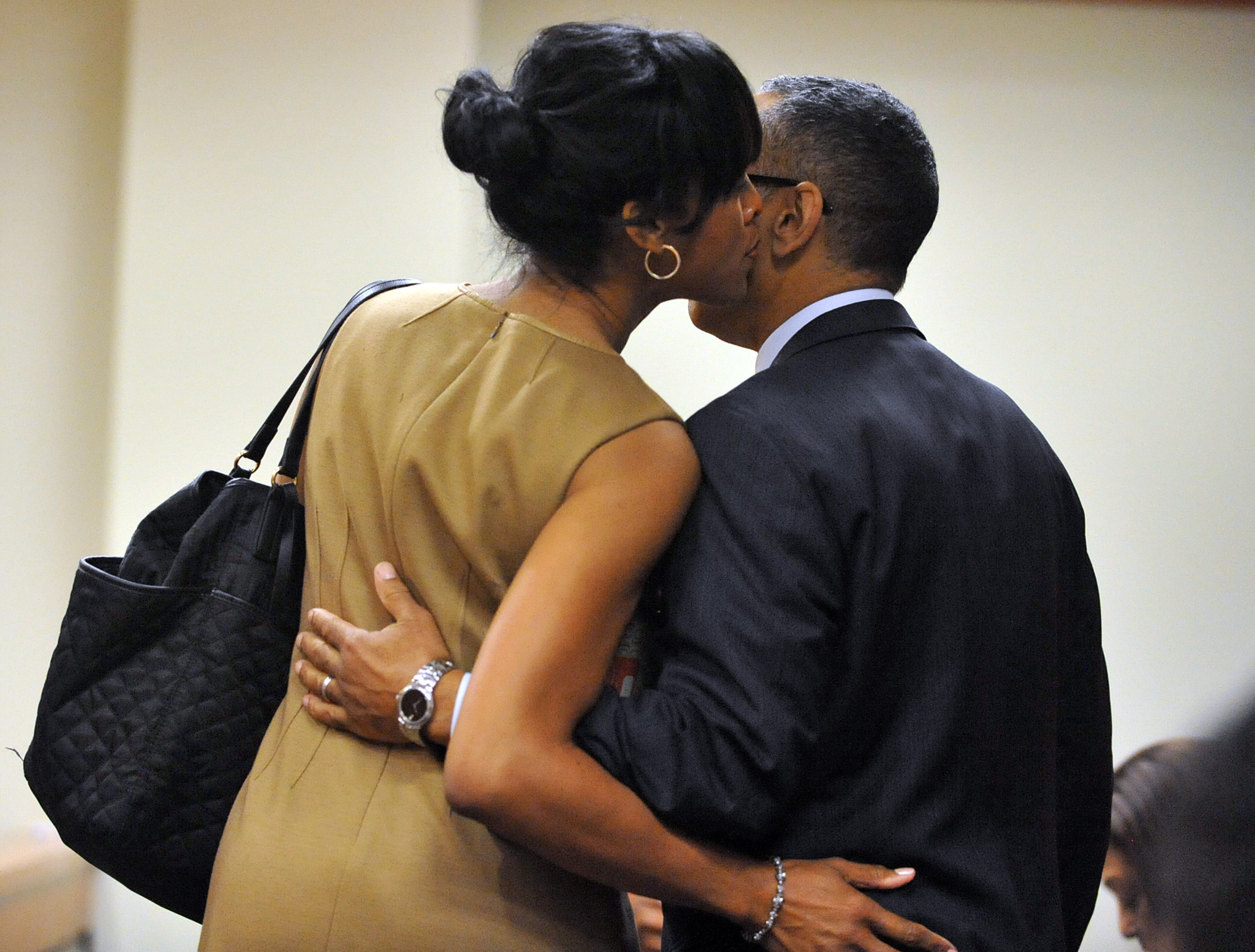 DeKalb CEO Burrell Ellis hugs his wife, Philippa, before the verdict was read. He was found guilty on 4 counts in his retrial before Superior Court Judge Courtney Johnson Wednesday, July 1, 2015.