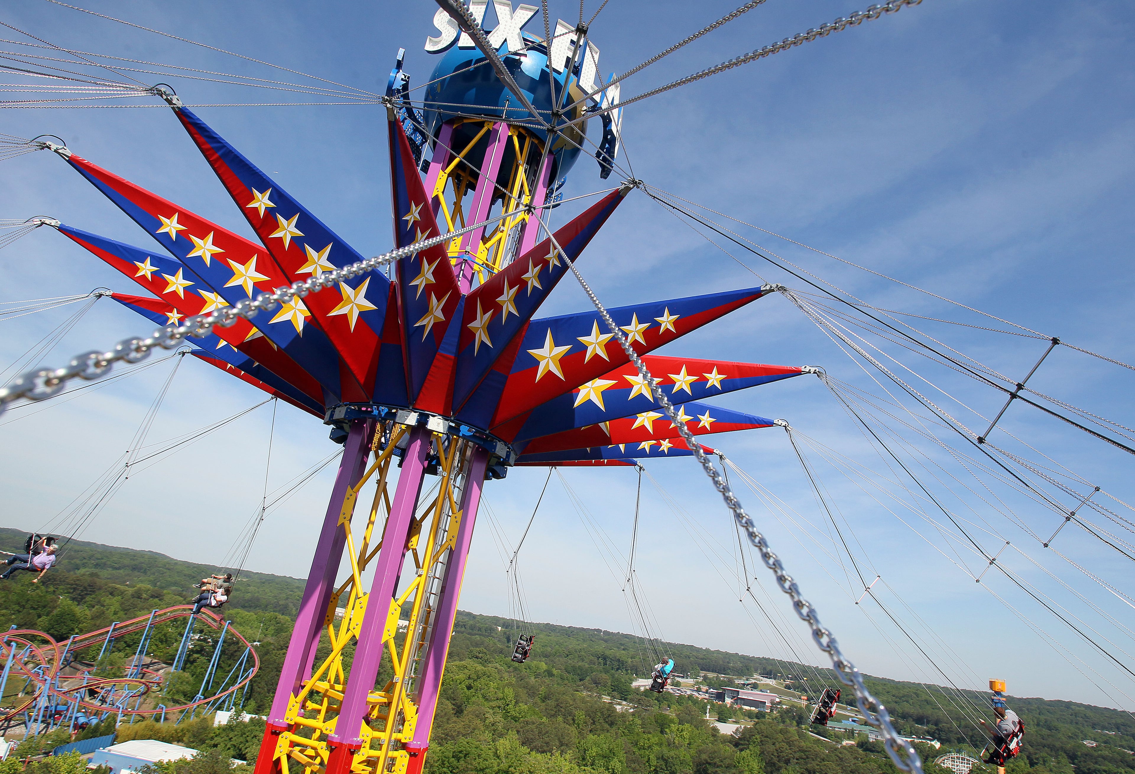 VIPs ride the new 24 story tall SkyScreamer extreme swing ride at Six Flags Over Georgia in Austell during a preview event on Thursday May 9th, 2013. PHIL SKINNER / PSKINNER@AJC.COM