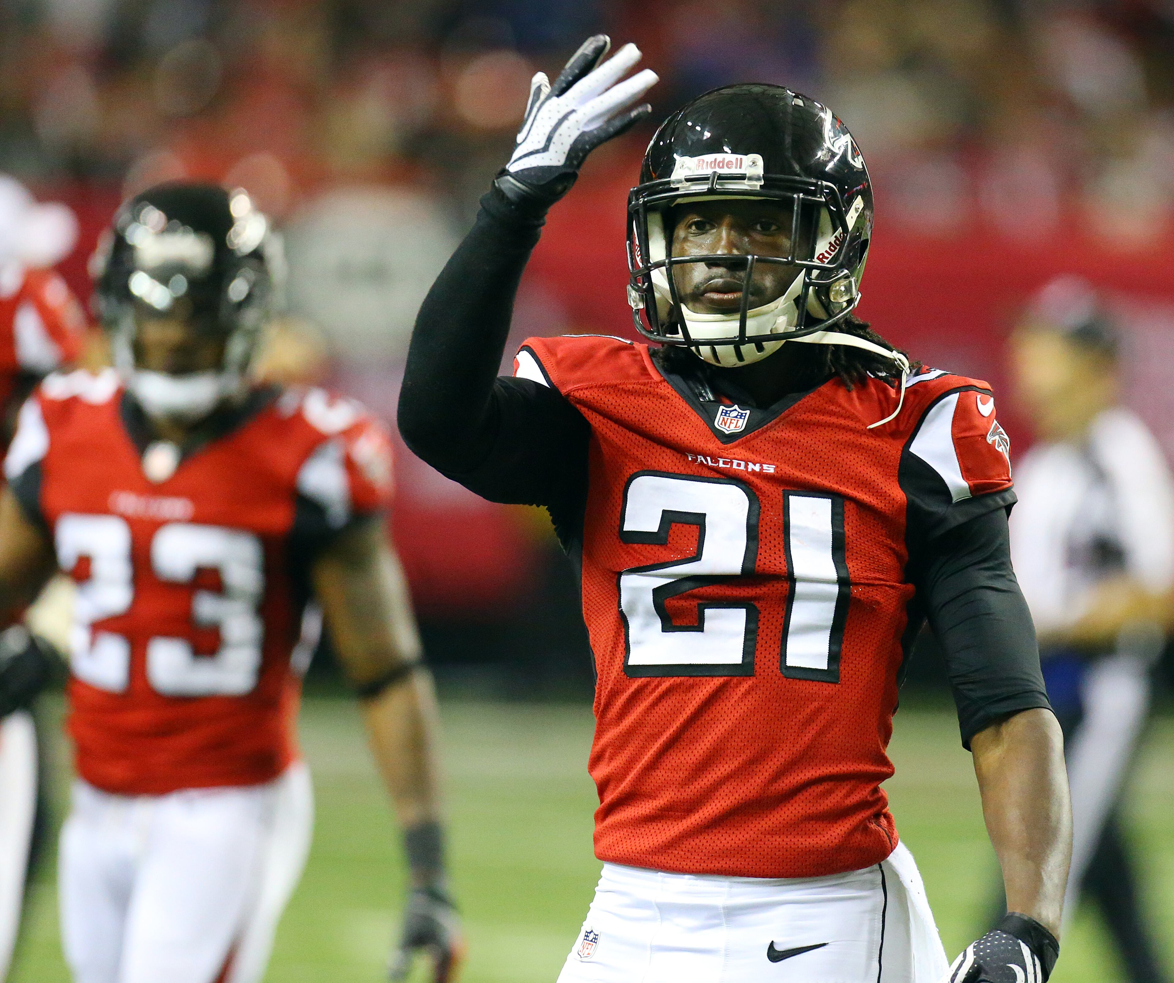 Falcons cornerback Desmond Trufant celebrates intercepting Redskins quarterback Kirk Cousins during the second half of a NFL football game on Sunday, Dec. 15, 2013, in Atlanta.