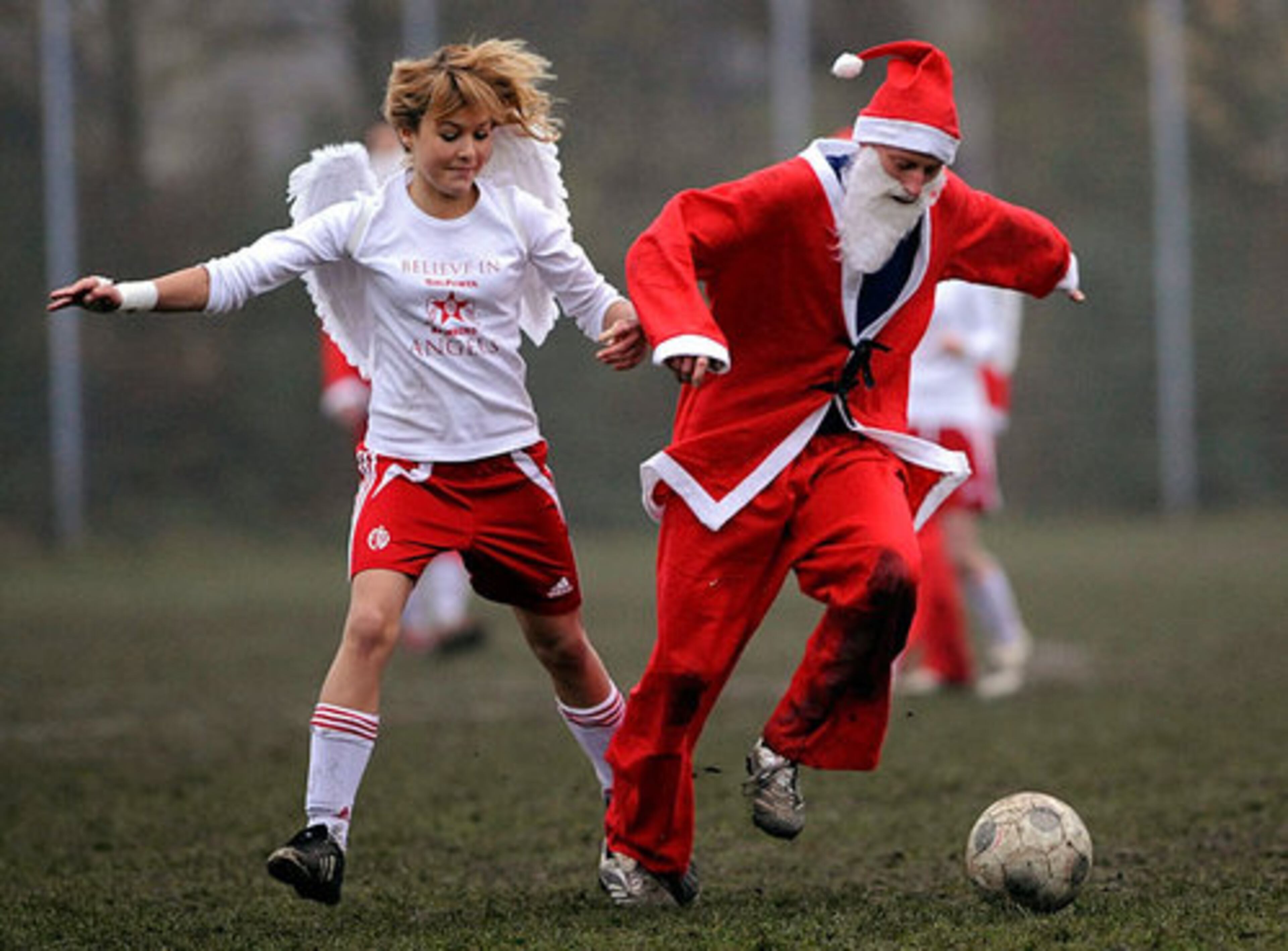 Santa mixes it up with the angels during a charity soccer match in Hamburg, Germany.
