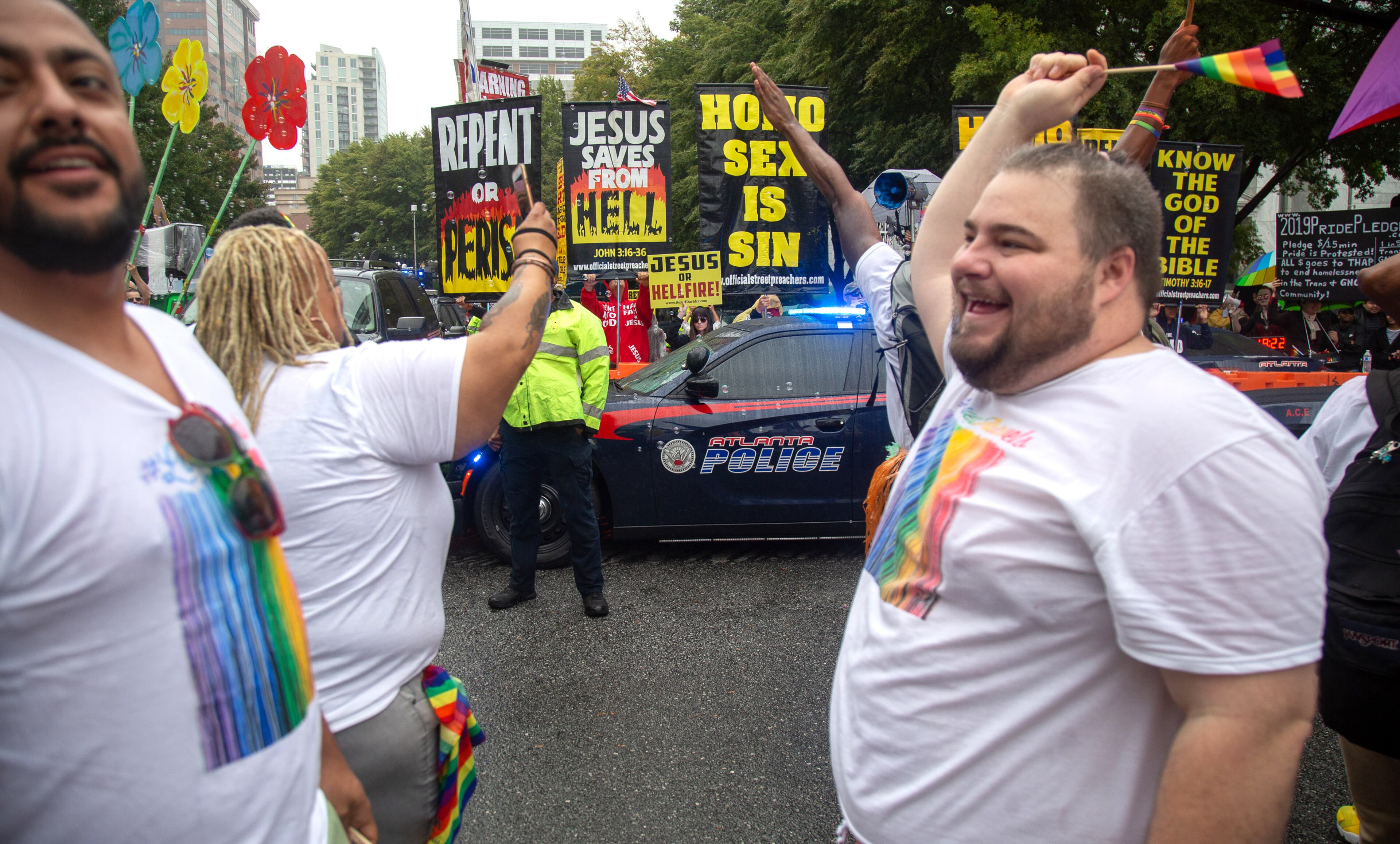 Protesters set up on Peachtree Street during the 49th annual Pride Festival and Parade in Atlanta on Sunday, Oct. 13, 2019. STEVE SCHAEFER / SPECIAL TO THE AJC