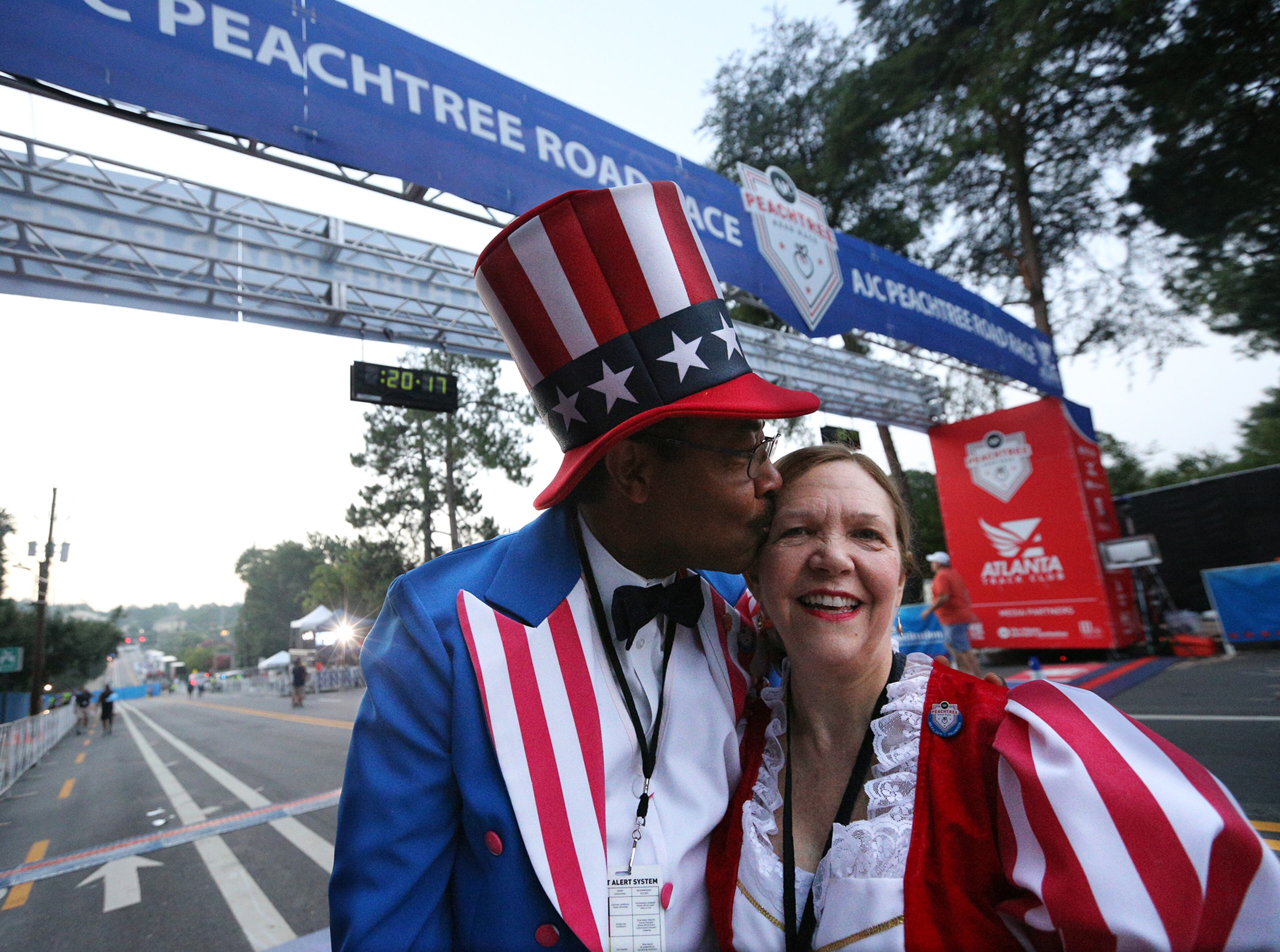 July 04, 2017 Atlanta: Reg and Paula Barnes, who play Uncle Sam and Betsy Ross, arrive at the finish line where they will hold the tape for the winners in the 48th running of the Peachtree Road Race on Tuesday, July 4, 2017, in Atlanta. Curtis Compton/ccompton@ajc.com
