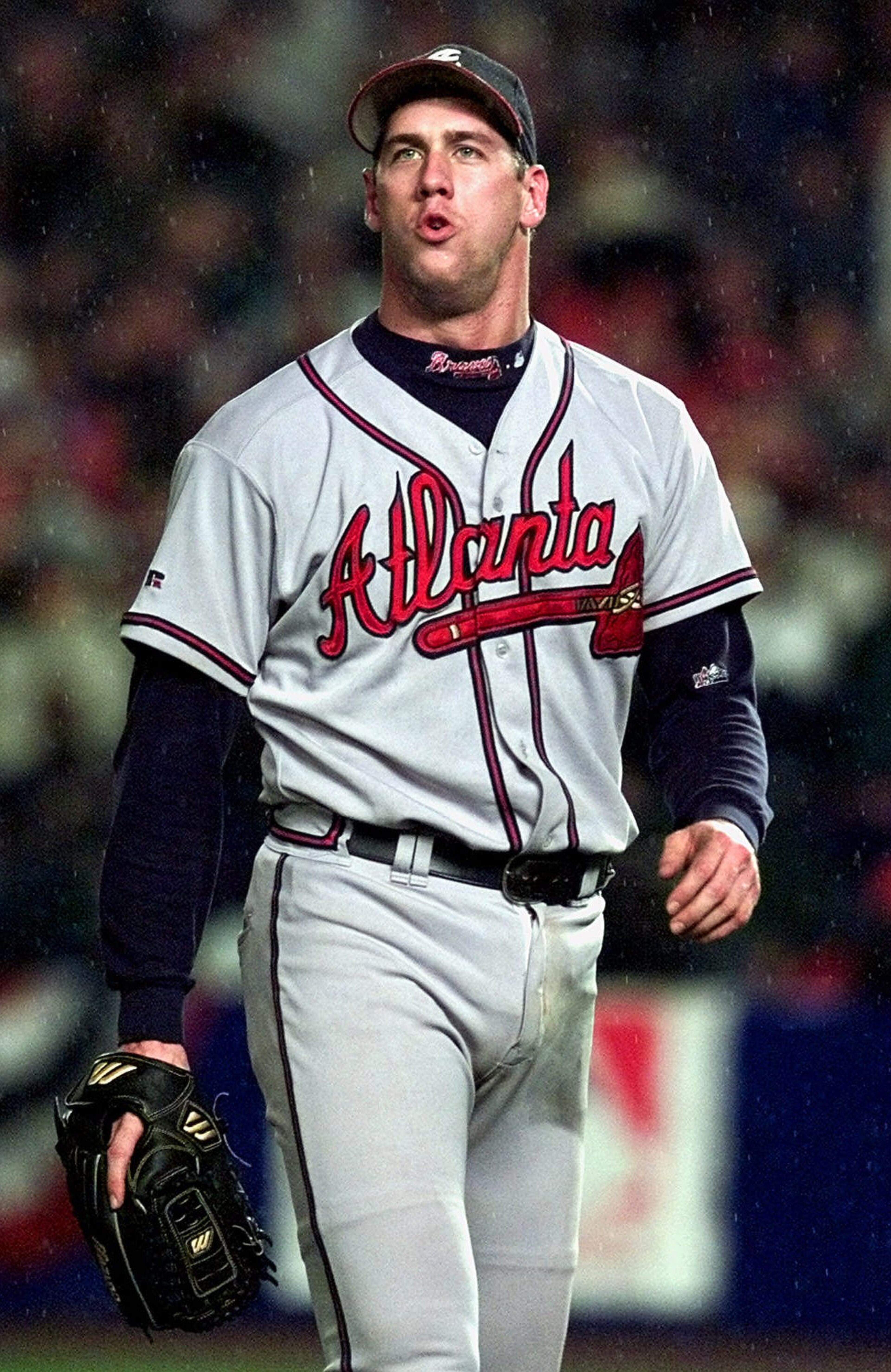 Atlanta Braves pitcher John Rocker boos fans as he leaves the game in 14th inning against the New York Mets during Game 5 of the NL Championship Series Sunday, Oct. 17, 1999, in New York.