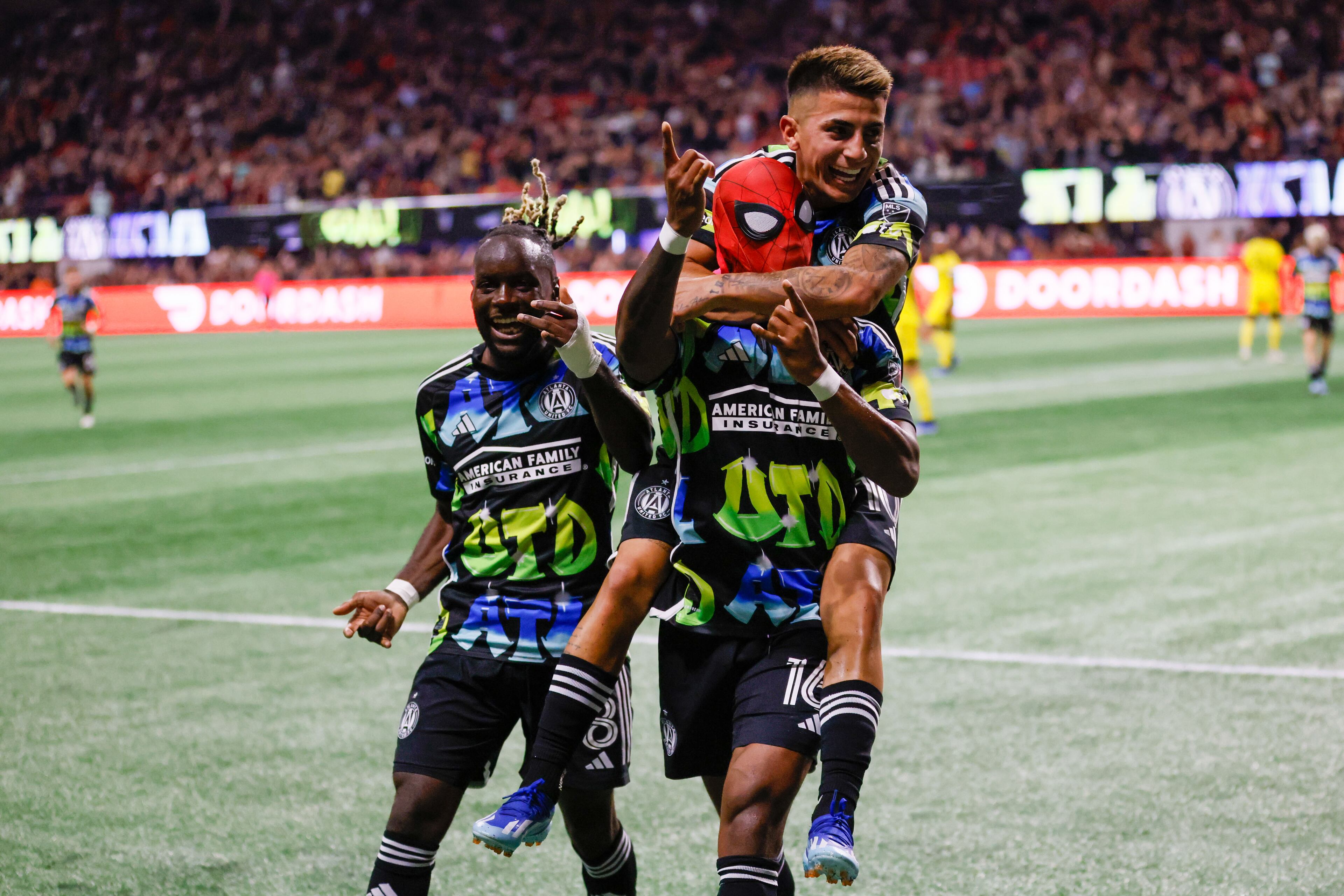 Atlanta United midfielder Thiago Almada (10) embraces forward Xande Silva (16), who donned a Spider-Man mask, as they celebrate Silva’s goal during the first half against Columbus Crew in Game 2 of a first-round MLS playoff game at Mercedes-Benz Stadium on Tuesday, Nov. 7, 2023. Atlanta United won 4-2.
Miguel Martinez / miguel.martinezjimenez@ajc.com