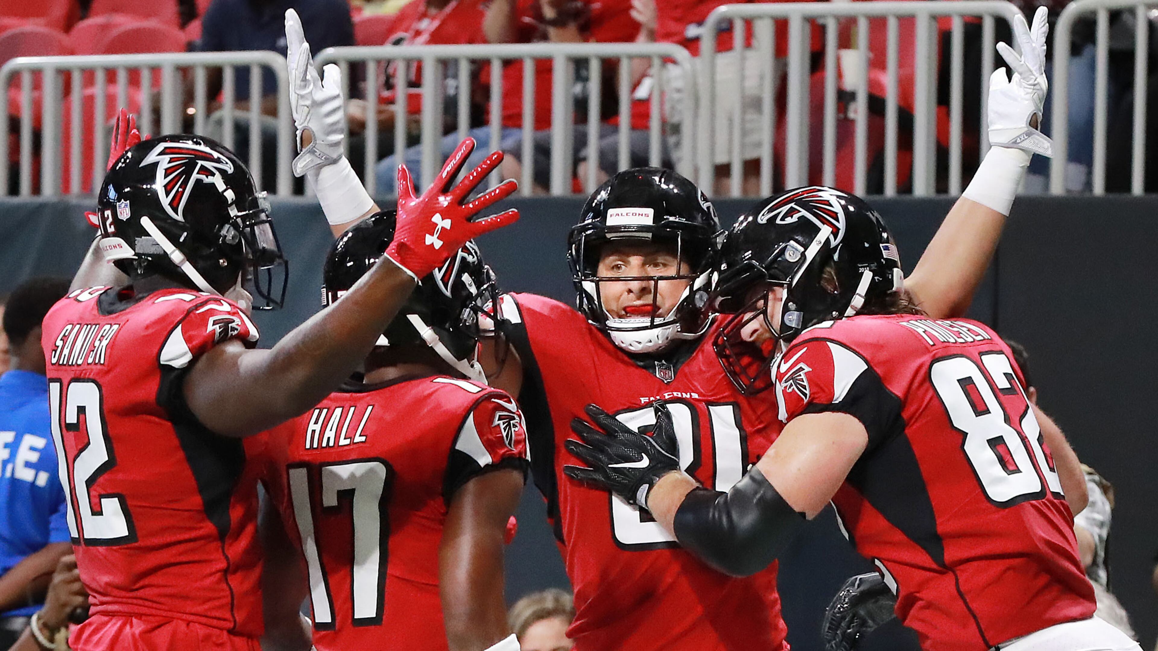 Falcons tight end Austin Hooper celebrates his touchdown with teammates in the end zone Friday, Aug. 17, 2018, at Mercedes-Benz Stadium in Atlanta.