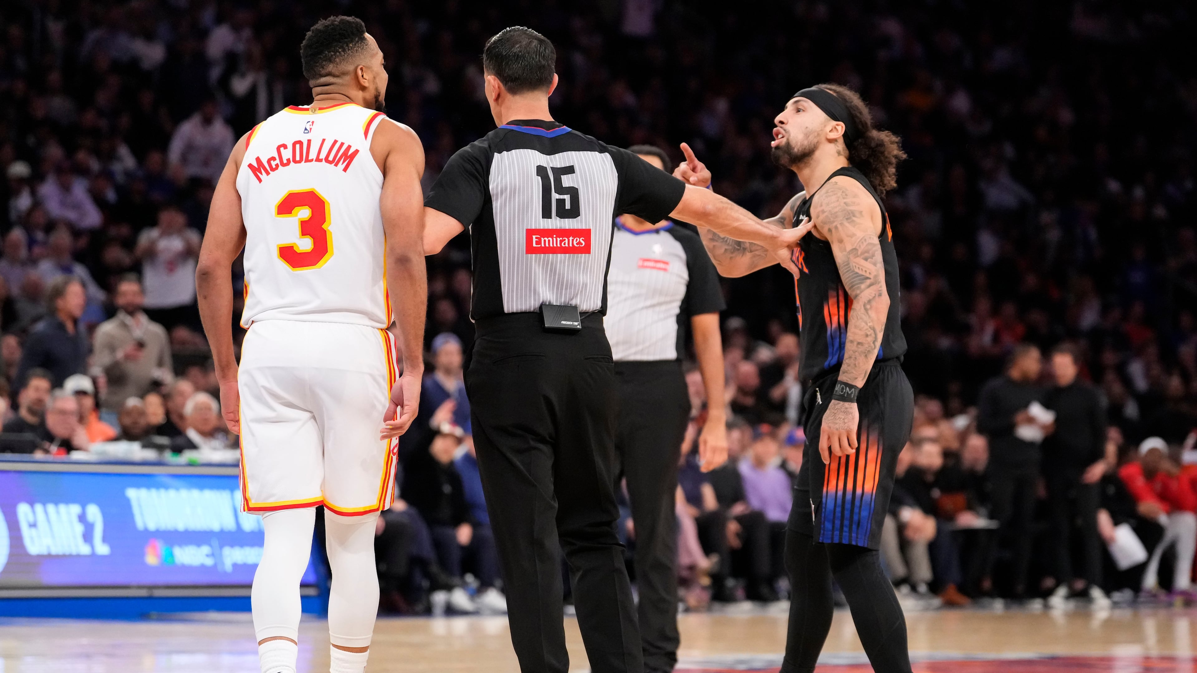 New York Knicks guard Jose Alvarado, right, argues with Atlanta Hawks guard CJ McCollum (3) during the second half in Game 2 of a first-round NBA playoffs basketball series, Monday, April 20, 2026, in New York. (AP Photo/Yuki Iwamura)