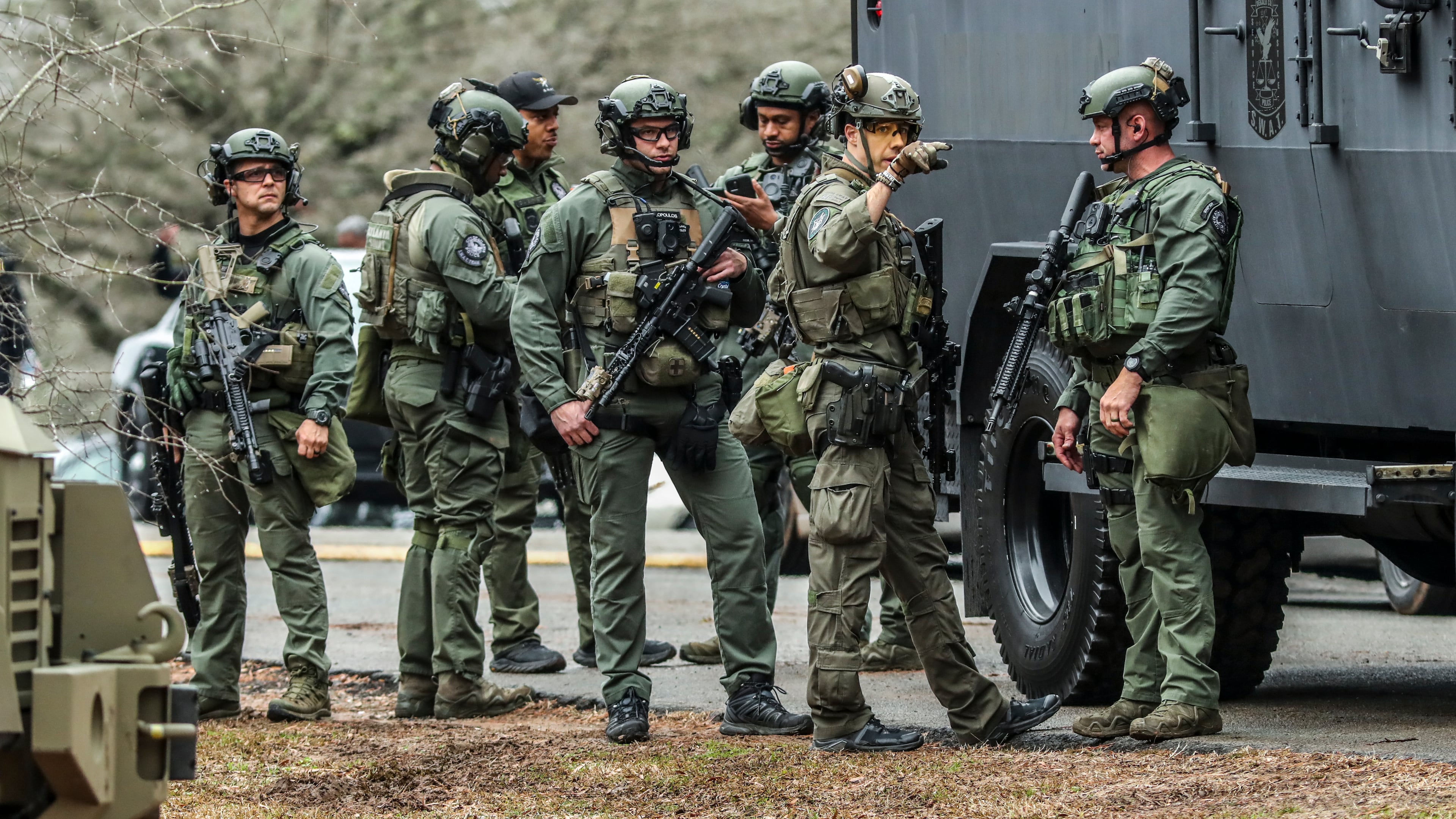 January 18, 2023 ATLANTA: DeKalb and Atlanta SWAT members leaving from Gresham Park command post. Georgia state troopers helping conduct a Òclearing operationÓ at the site of AtlantaÕs planned public safety training center exchanged gunfire with a protester Wednesday morning, Jan. 18, 2023 leaving the protester dead and one trooper wounded, according to the Georgia Bureau of Investigation. The purported protester, who was accused of firing first, was believed to be a male. His identity was not immediately released. The wounded trooper also was not identified. He was in surgery around lunchtime Wednesday and in stable condition, Georgia State Patrol Col. Chris Wright said during a brief press conference outside Grady Memorial Hospital. Few other details about the incident near Constitution Road, just south of the proposed training center site in southwestern DeKalb, have been released. Law enforcement was out en masse at nearby Gresham Park and along Key Road to the north. (John Spink / John.Spink@ajc.com)