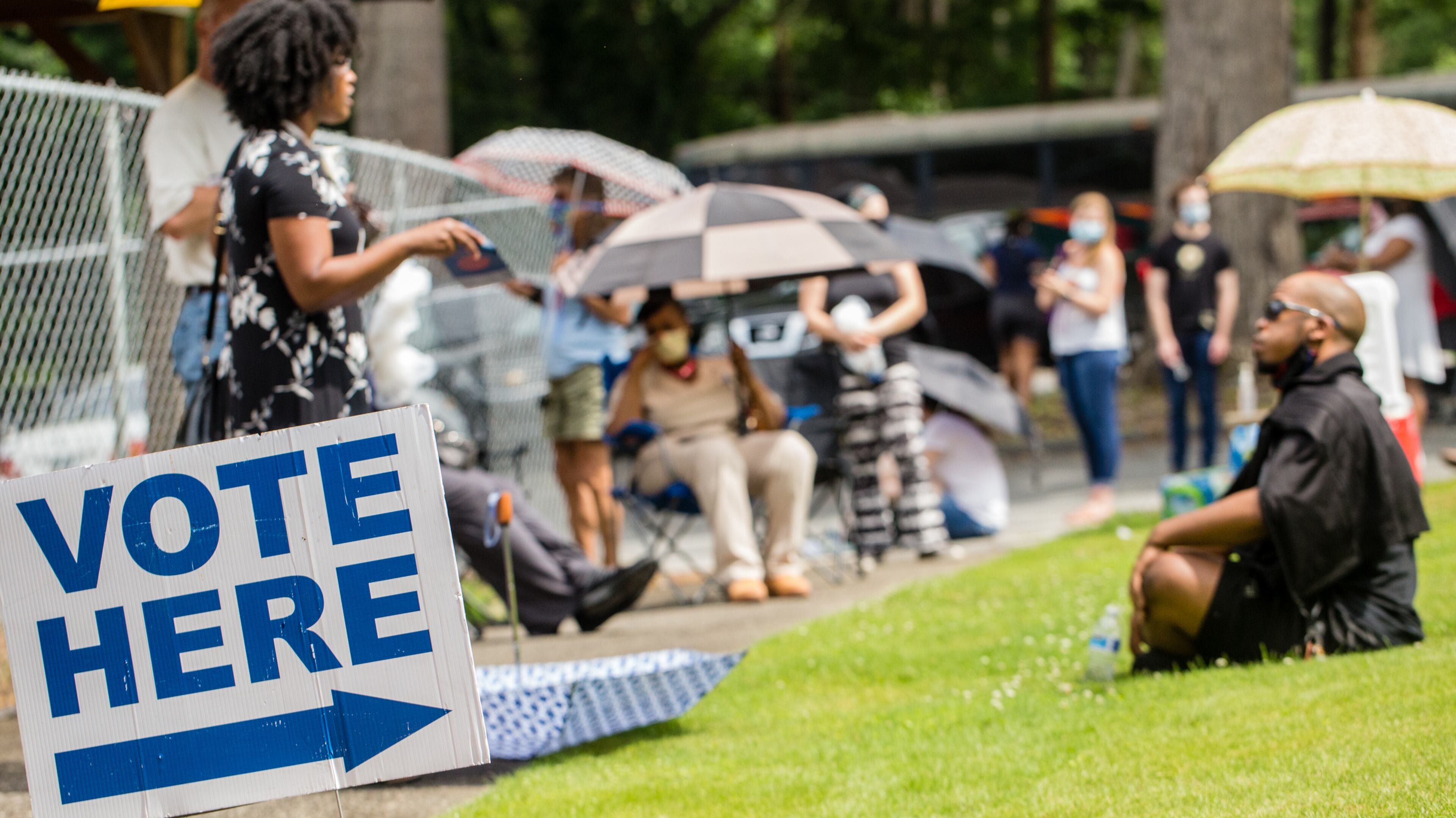 Voters wait in long lines, at times in the rain, at New Beginnings Full Gospel Church on Tuesday, June 9, 2020. The lines were taking more than 3.5 hours. This polling location opened at 7 am with only one machine of the four available working and had two of the four working at 4:30 and were not providing provisional ballots. (Jenni Girtman for The Atlanta Journal-Constitution)