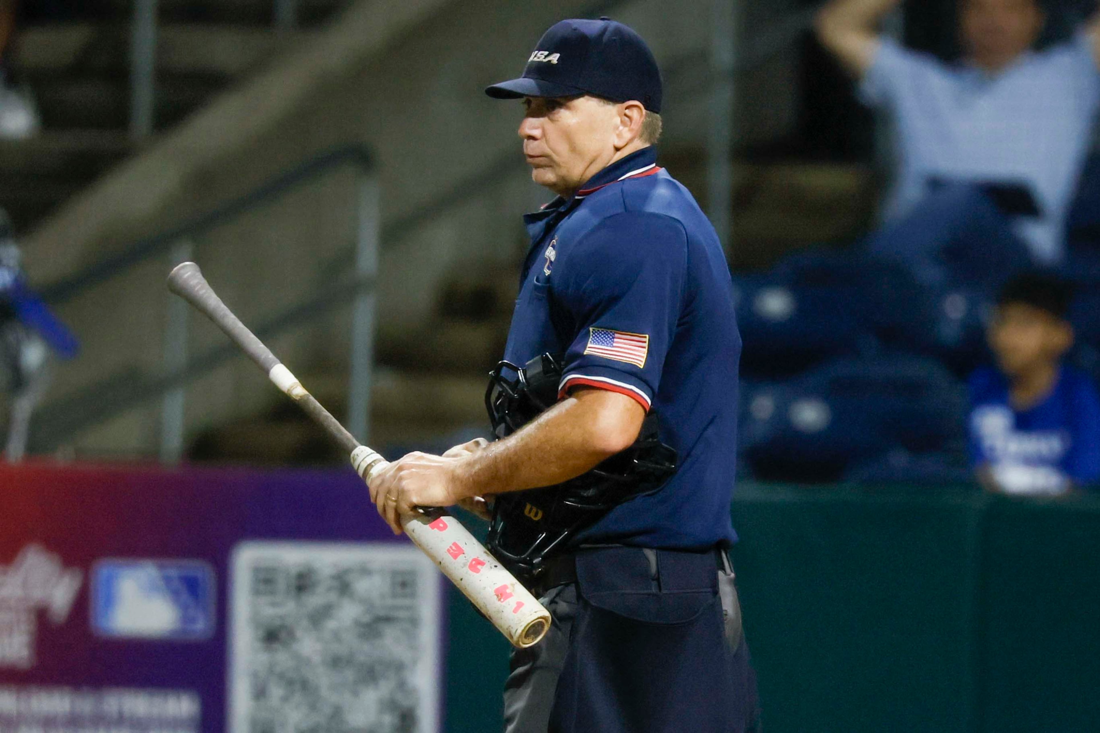 An umpire reviews the bat from Etowah Eagles pitcher Matthew Sharman during the 7th inning of Game 1 of the Class 6A GHSA Baseball State Championship Series at Gwinnett Field, on Tuesday, May 26, 2026, in Lawrenceville, Ga. Etowah faced North Paulding. (Miguel Martinez/AJC)