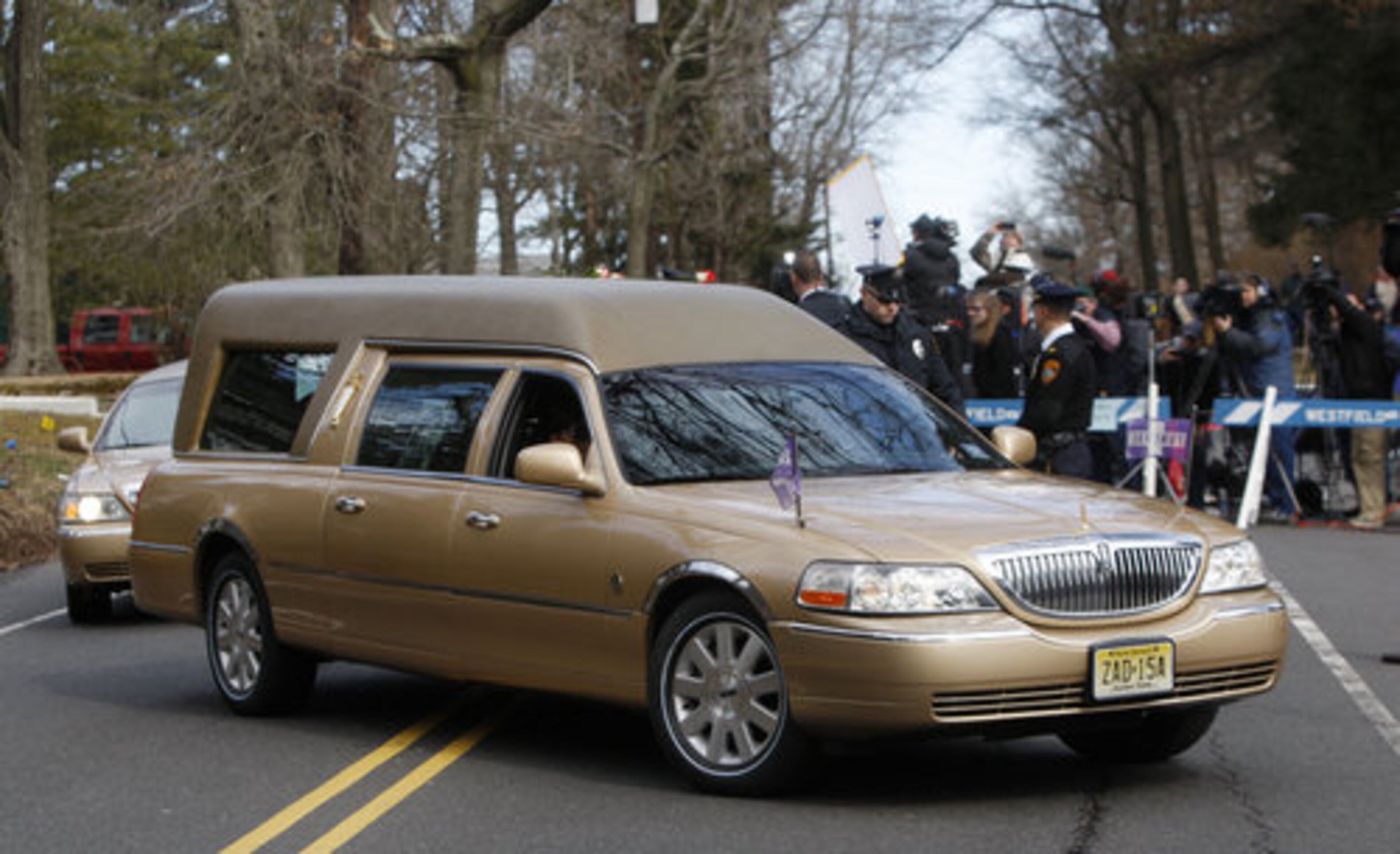 The hearse carrying the body of Whitney Houston arrives at Fairview Cemetery for her burial in Westfield, N.J., Sunday, Feb. 19, 2012.