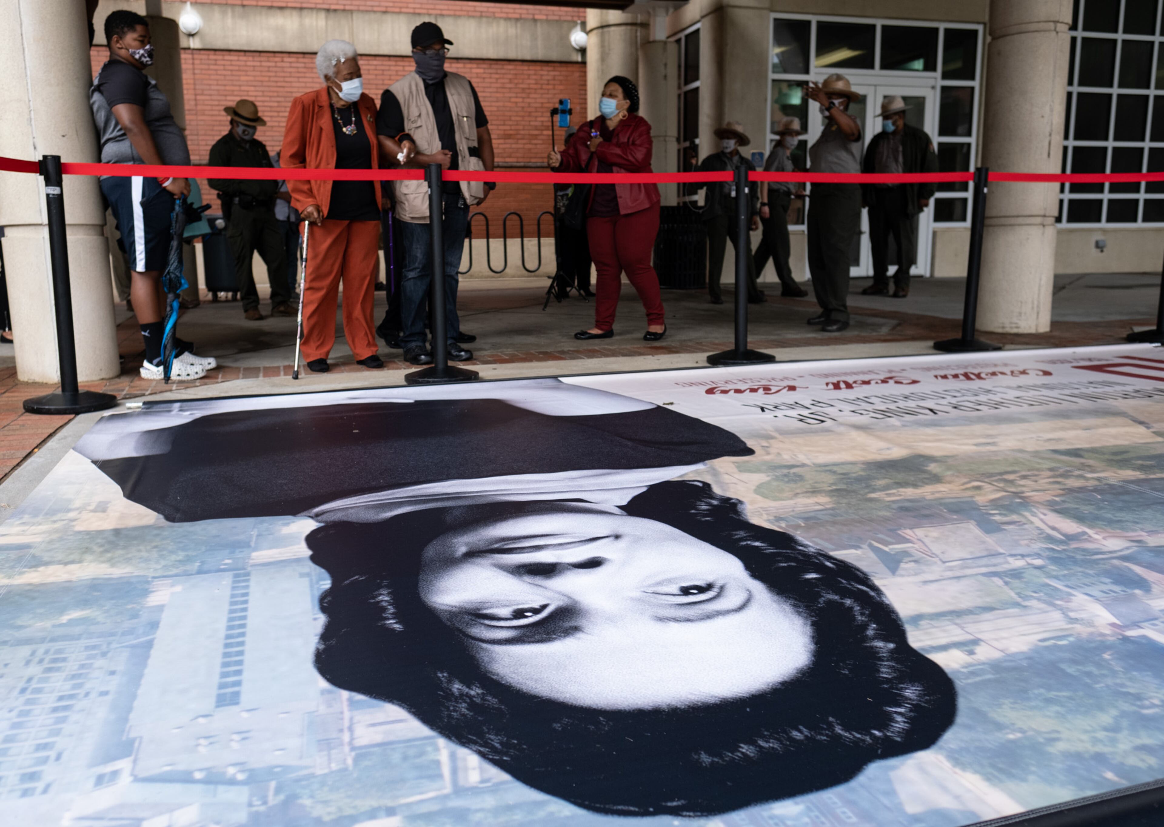 Naomi King, wife of MLK's brother A.D. Williams King, and guest of the ribbon-cutting ceremony look over one of the banners in the new exhibit on Saturday, October 10, 2020, at the Martin Luther King Jr. National Historic Park in Atlanta. (Photo: Ben Gray for The Atlanta Journal-Constitution)