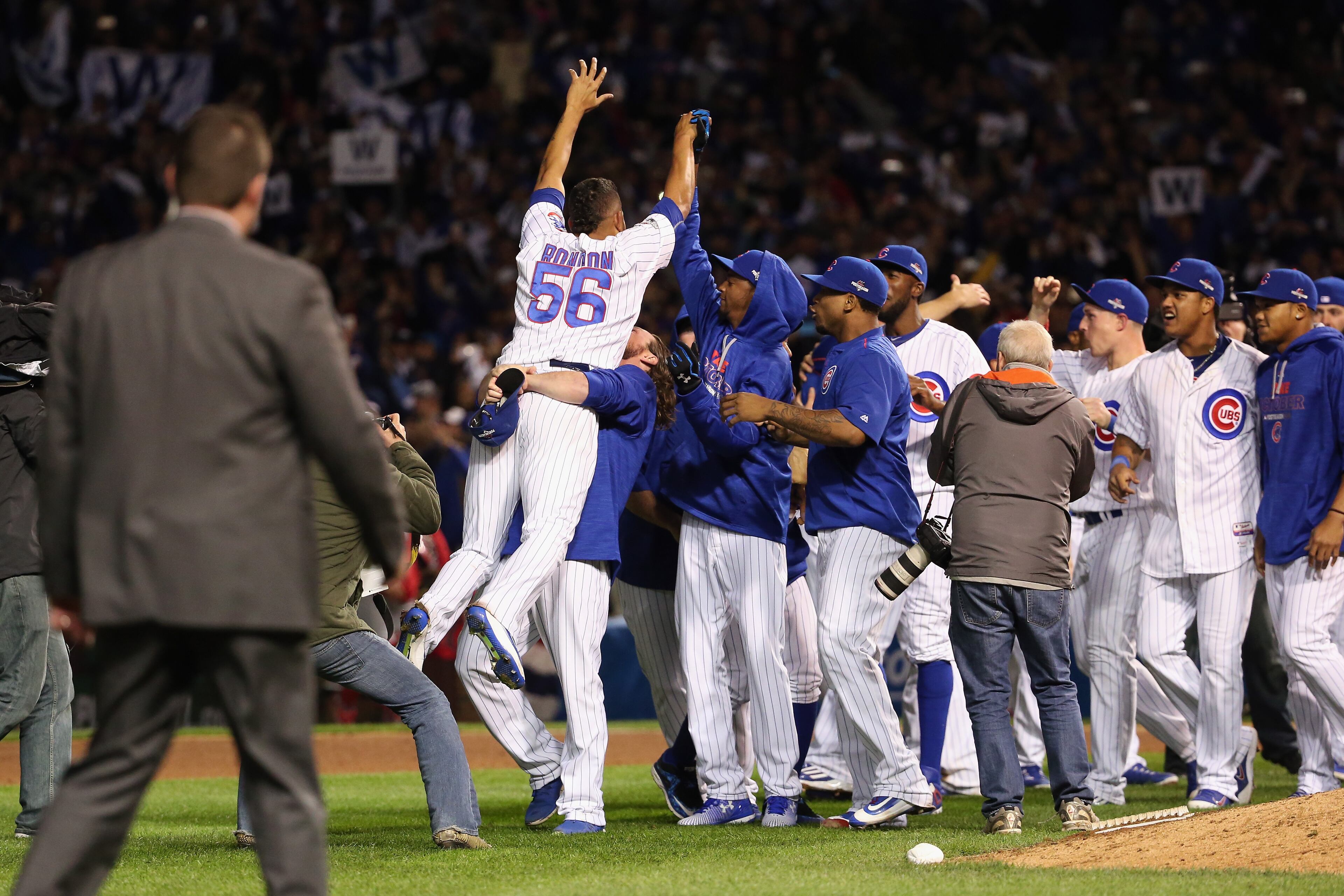 Hector Rondon #56 of the Chicago Cubs celebrates with teammates after defeating the St. Louis Cardinals 6-4 in game four of the National League Division Series at Wrigley Field on October 13, 2015 in Chicago, Illinois. (Photo by Jonathan Daniel/Getty Images)