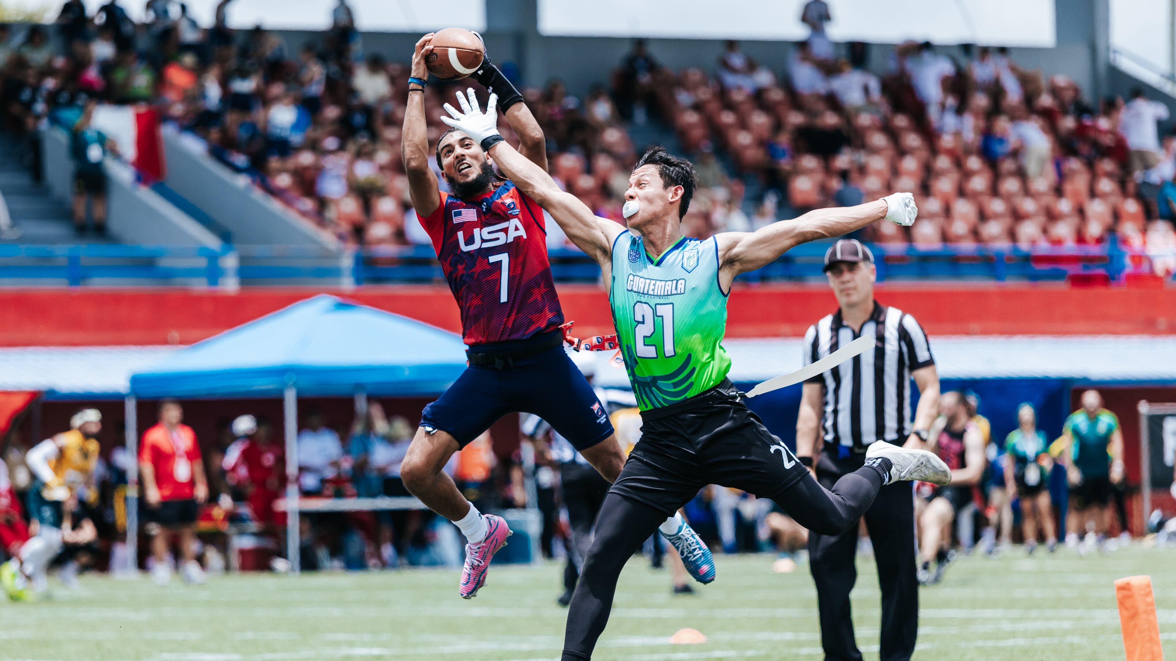 This photo provided by USA Football shows quarterback Darrell “Housh” Doucette III, left, in Panama in September 2025. (Lester Barnes/USA Football via AP)