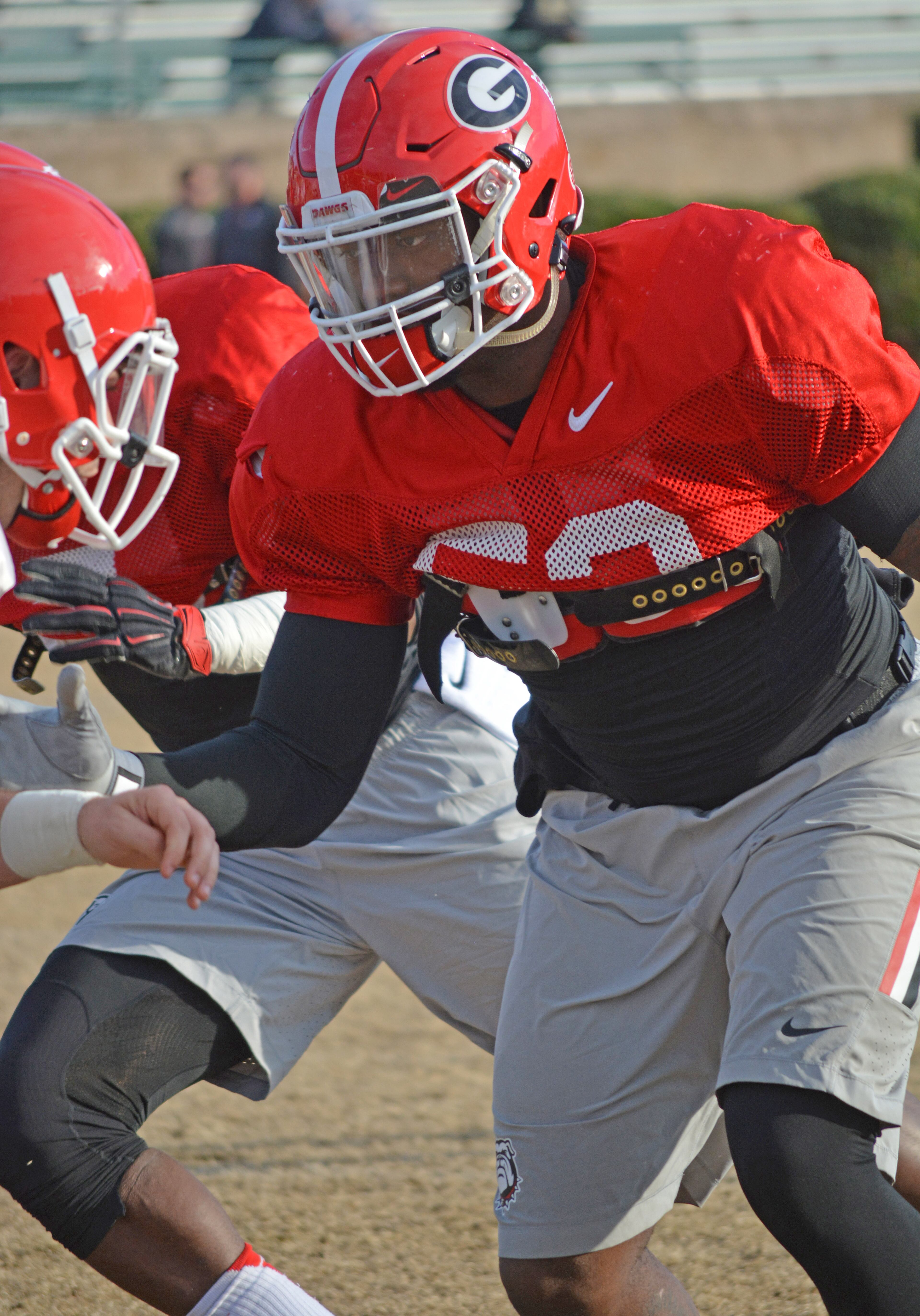 Linebacker Amarlo Herrera runs a drill during a Belk Bowl practice at Charlotte Country Day School in Charlotte, N.C., on Saturday, Dec. 27, 2014. (Photo by Steven Colquitt / UGA Sports)