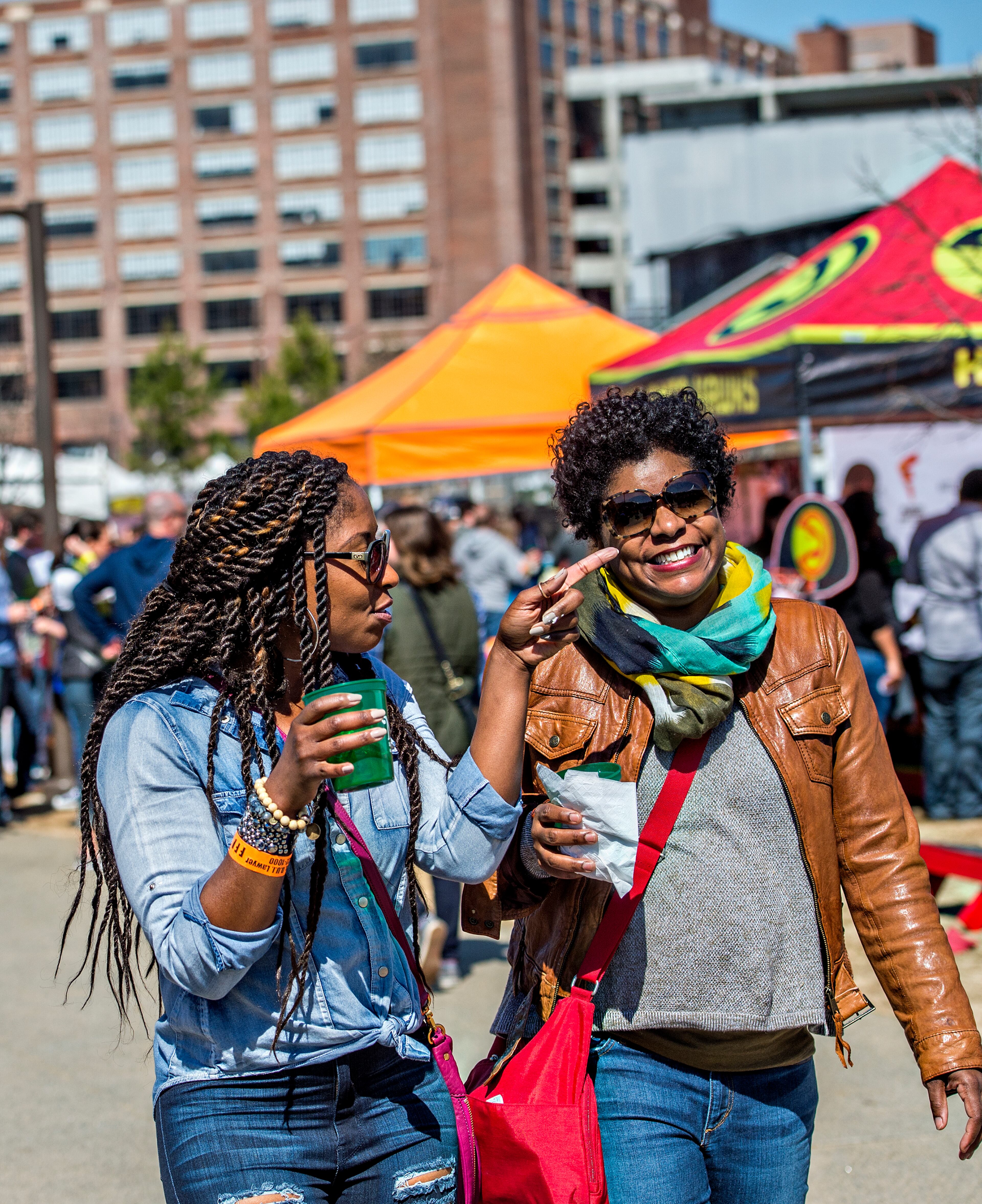 Karen Turner (left) and Dawn Hall walk through Fourth Ward Park during the Atlanta Brunch Festival on Saturday, March 5, 2016. Six thousand people came out to taste brunch from 41 restaurants and food trucks, drink mimosas and bloody marys, and listen to music. JONATHAN PHILLIPS / SPECIAL