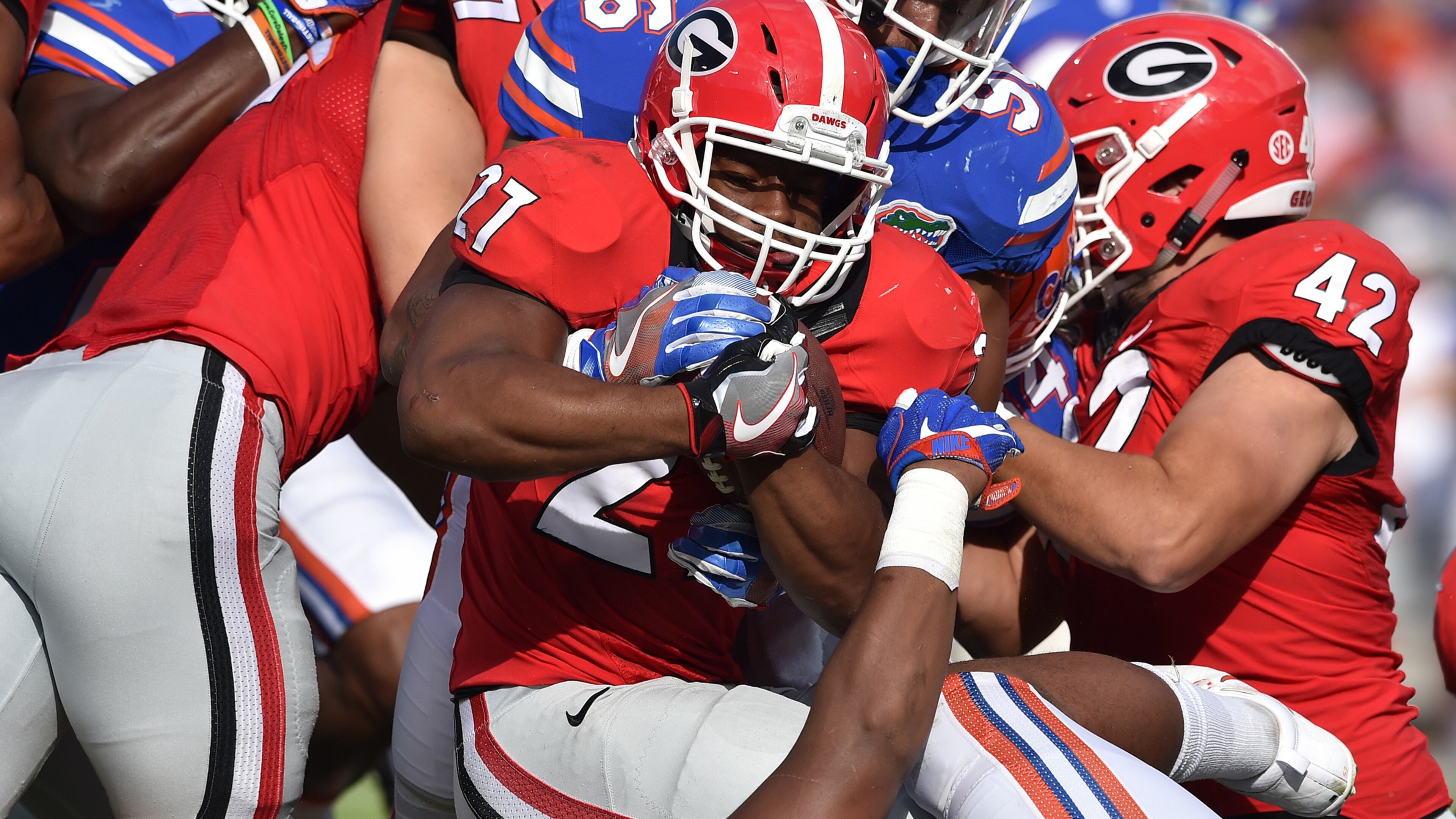 Georgia running back Nick Chubb, who was held to 20 yards, is brought down in the first quarter against the Florida Gators at EverBank Field in Jacksonville. The Gators defeated the Bulldogs 24-10. (Brant Sanderlin / bsanderlin@ajc.com)