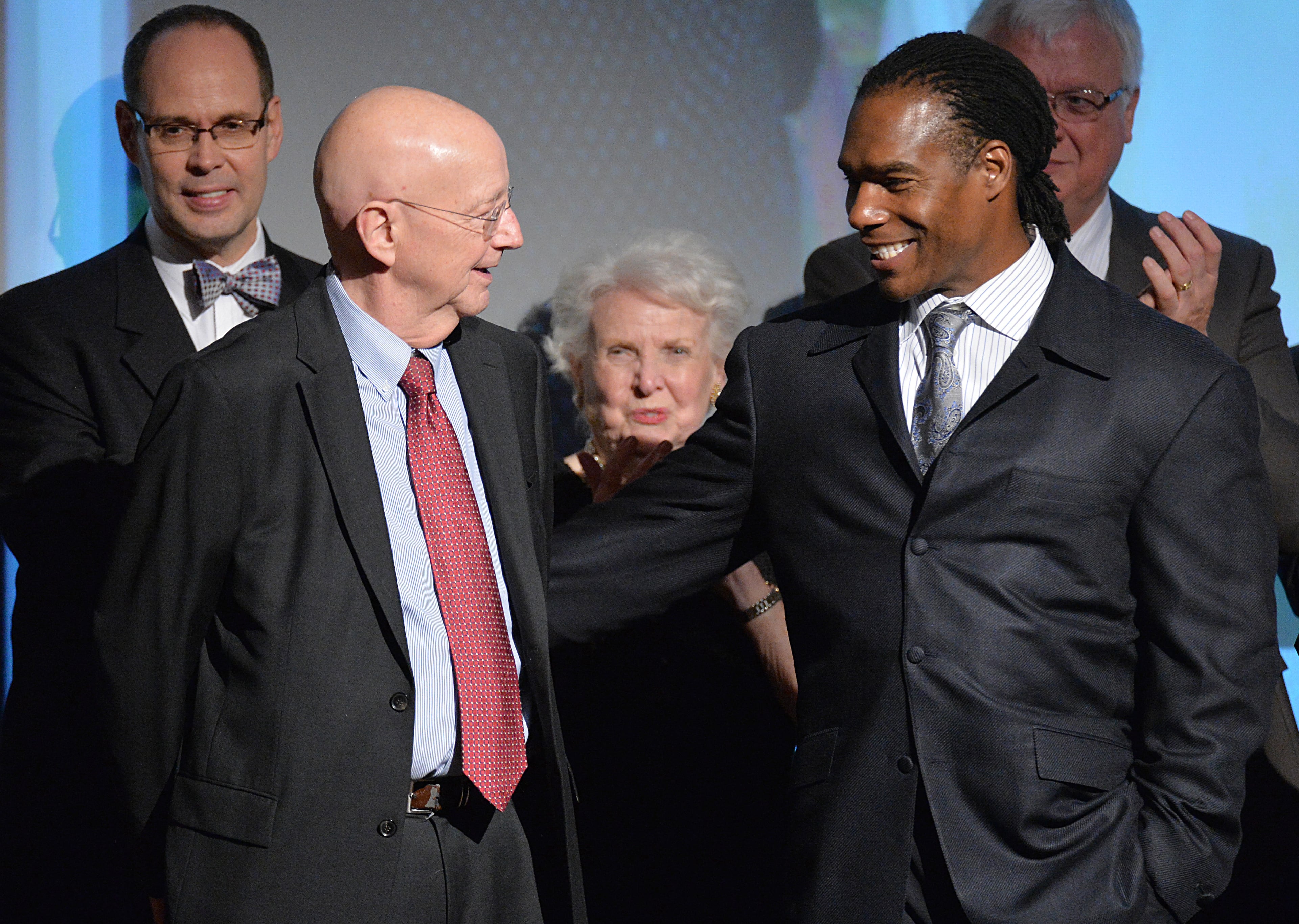 Pete Van Wieren (left) and Jessie Tuggle greet during the Atlanta Sports Hall of Fame Tenth Anniversary induction ceremony at Buckhead Theater in Atlanta on Friday, February 7, 2014.