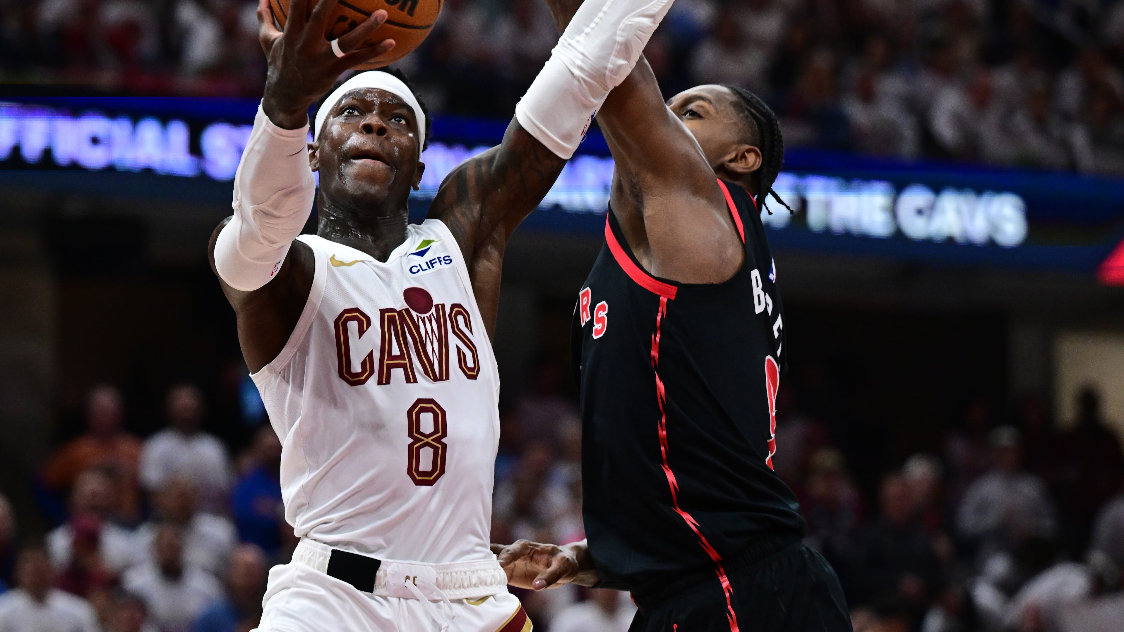 Cleveland Cavaliers guard Dennis Schroder goes to the basket against Toronto Raptors forward RJ Barrett during the second half in Game 5 of a first-round NBA playoffs basketball series, Wednesday, April 29, 2026, In Cleveland. (AP Photo/David Dermer)