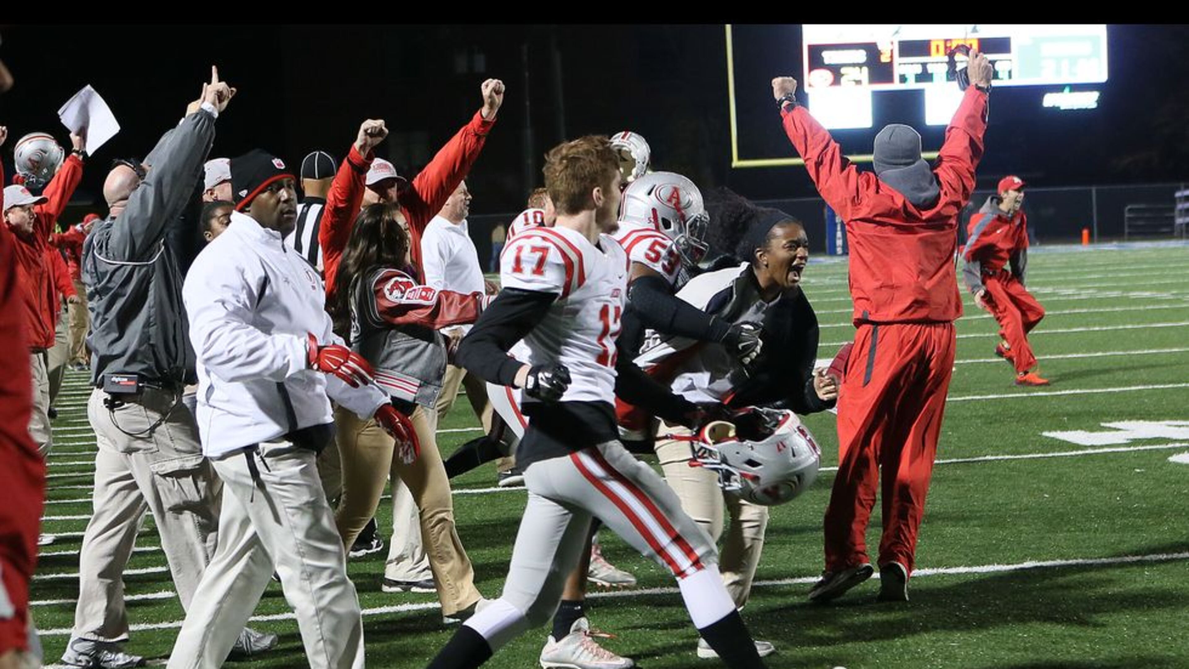 Archer players & coaches celebrate as the clock runs out on their 24-21 victory over McEachern in Powder Springs on Friday November 20th, 2015. Archer won 24-21. (Photo by Phil Skinner)