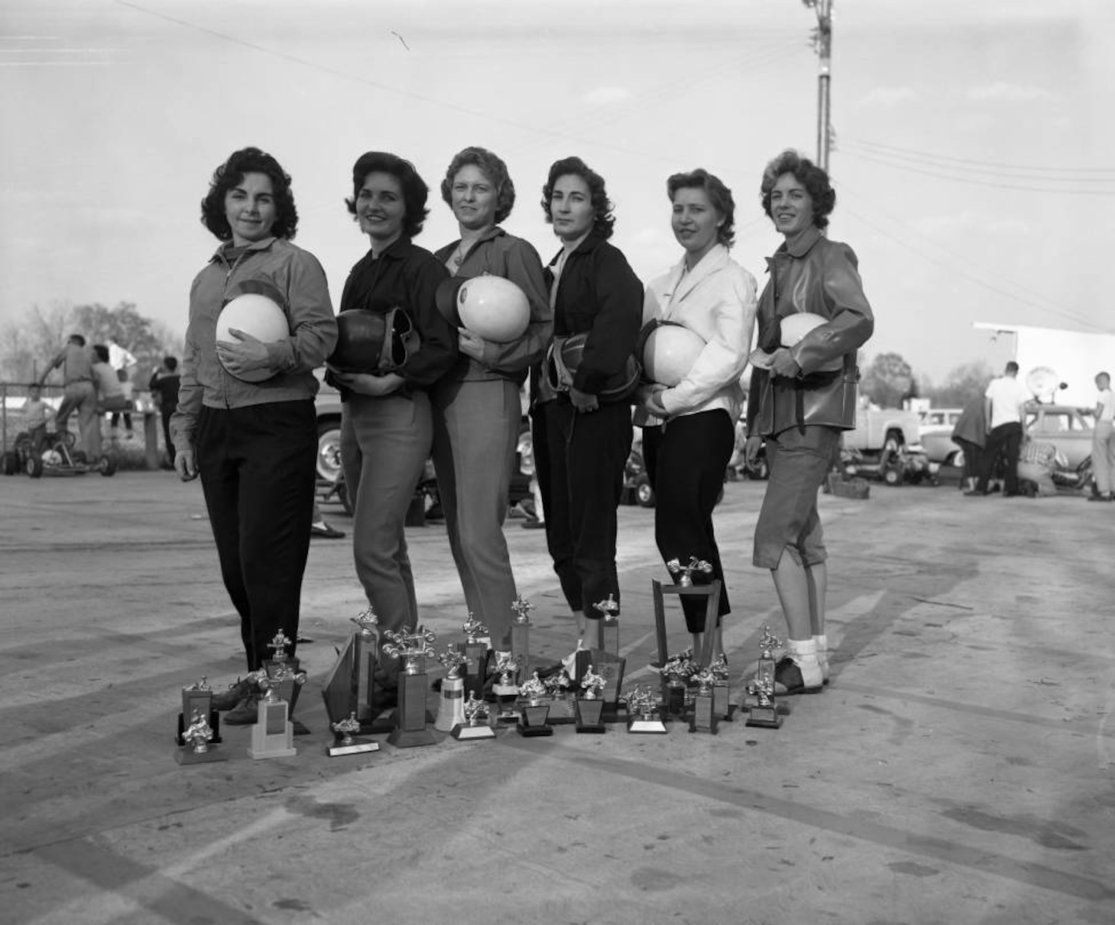 Go-kart race winners stand next to their trophies, 1961. J.C. Lee/AJC