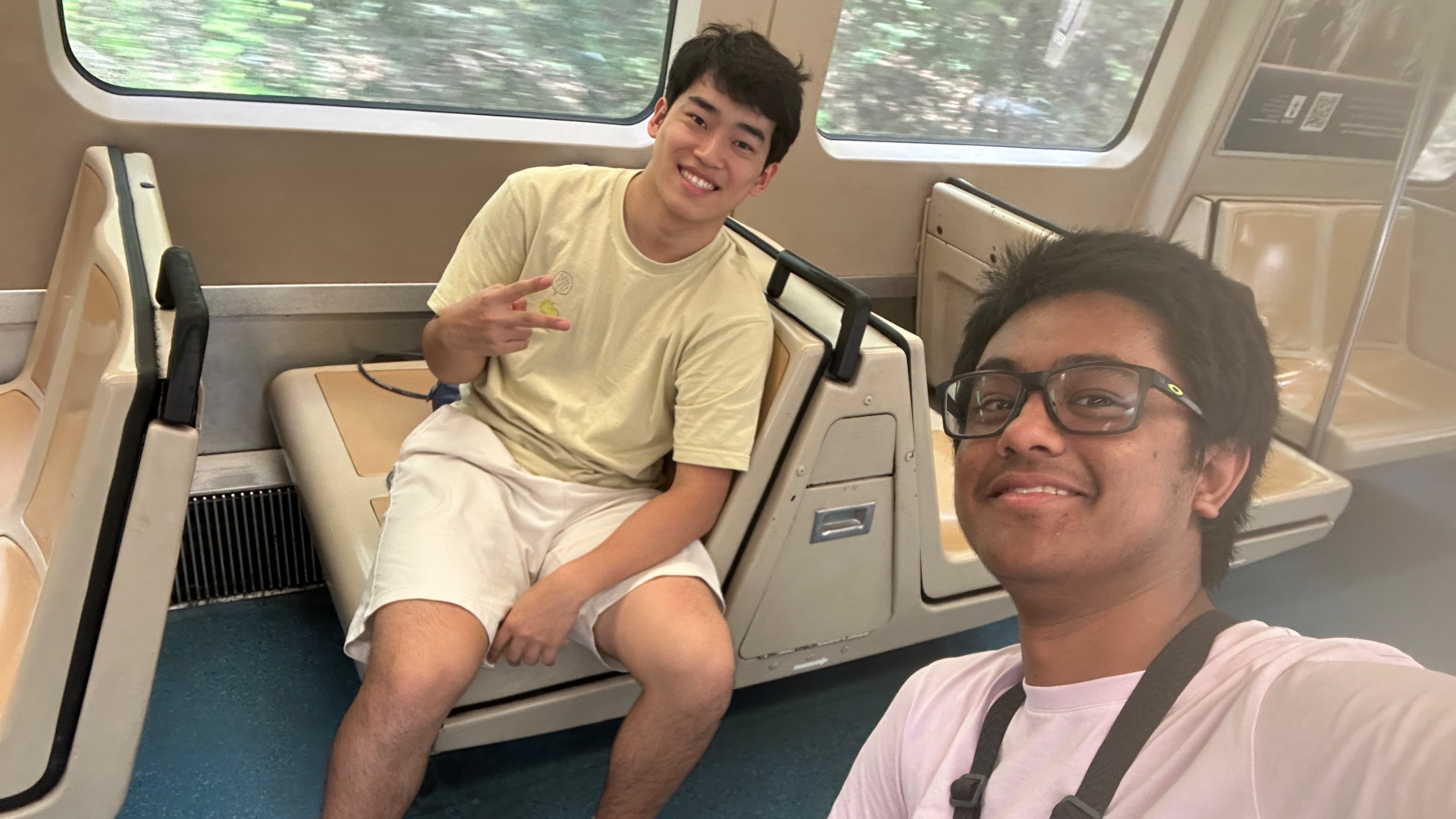 Andrew Zhang (left) and Ayush Maini pose on a MARTA train in middle of their attempt to visit all train stations in record time. Guinness World Records has to confirm their time to make a record official. (Courtesy of Ayush Maini)