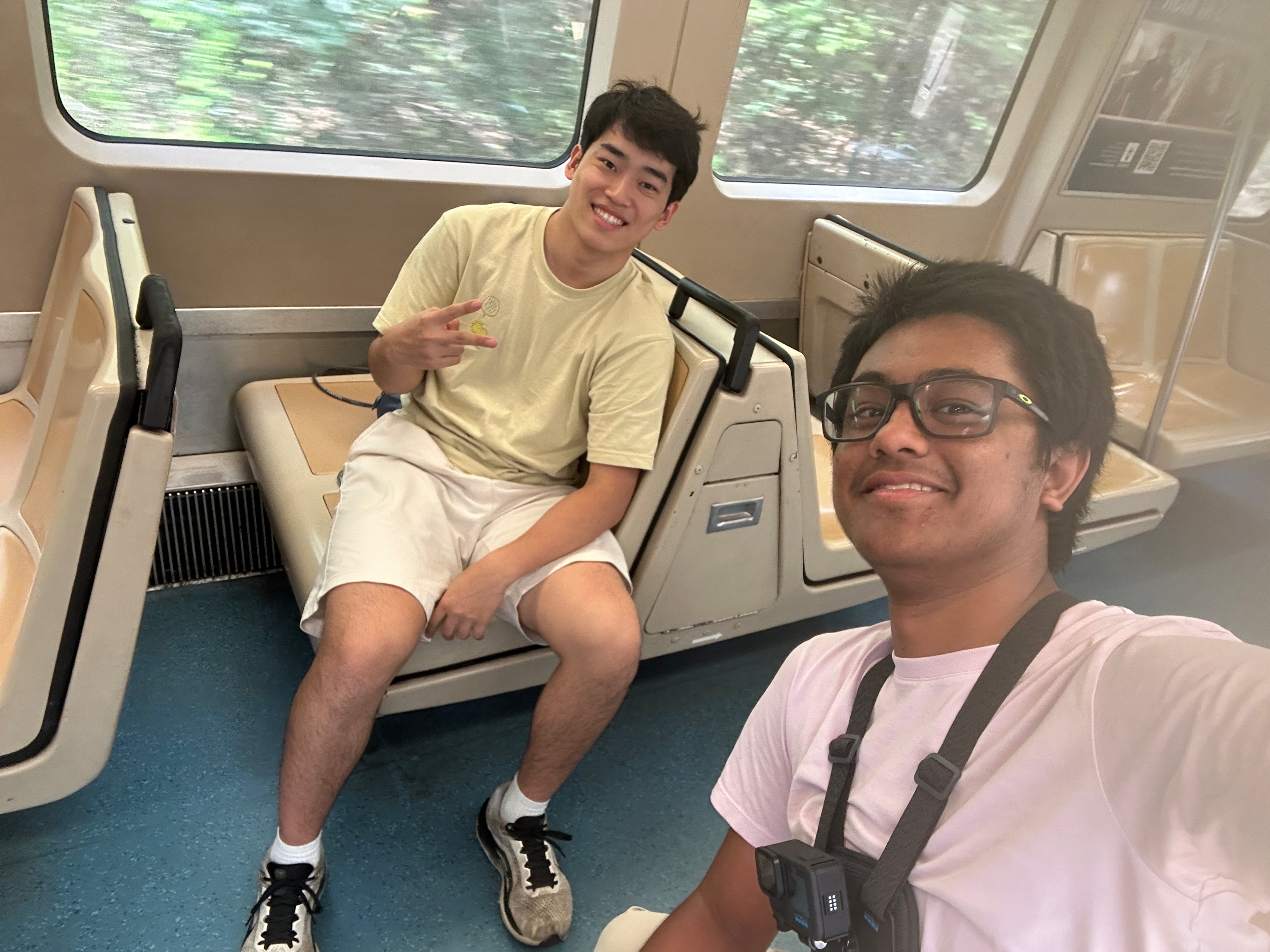 Andrew Zhang (left) and Ayush Maini pose on a MARTA train in the middle of their attempt to visit all train stations in record time. Guinness World Records has to confirm their time to make a record official. (Courtesy of Ayush Maini)