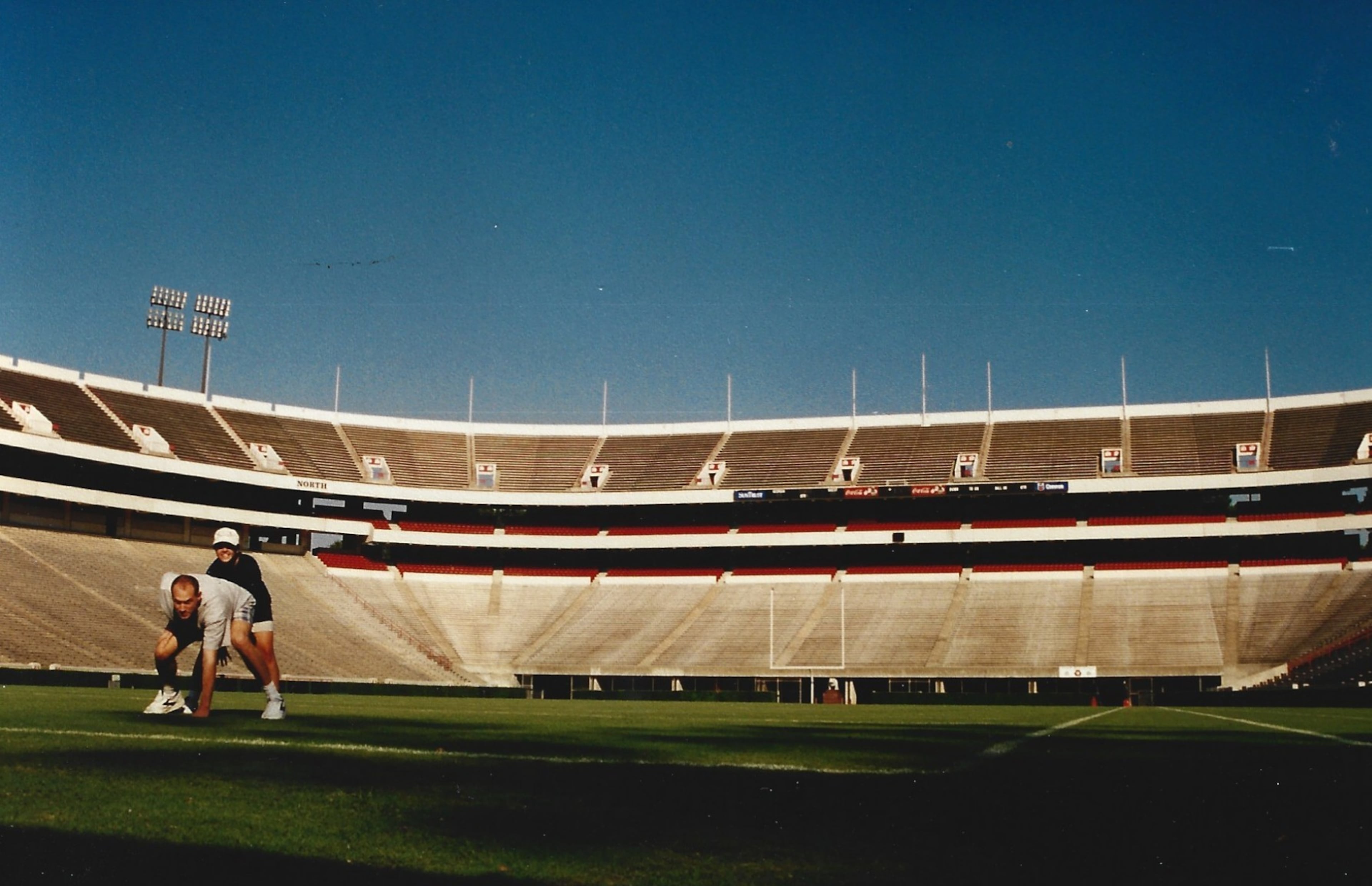 Steve and Heather pose together on the field at the University of Georgia's Sanford Stadium. Heather studied at UGA. (Courtesy of Steve Leo)