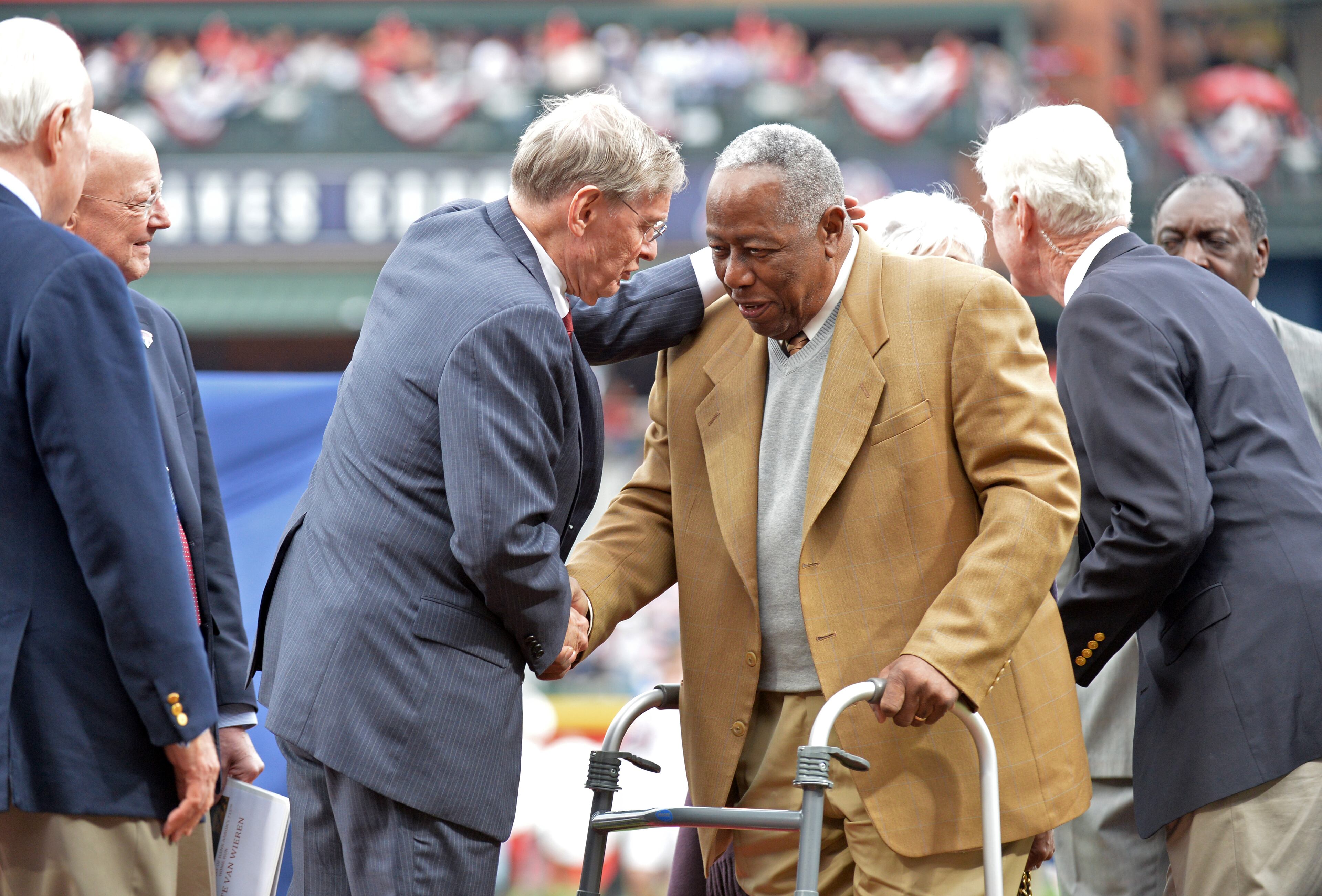 Commissioner of Major League Baseball Bud Selig congratulates Hank Aaron during a pregame ceremony to recognize the 40th anniversary of Hank Aaron's historic 715th home run before the season opener at Turner Field in Atlanta on Tuesday, April 8, 2014. HYOSUB SHIN / HSHIN@AJC.COM
