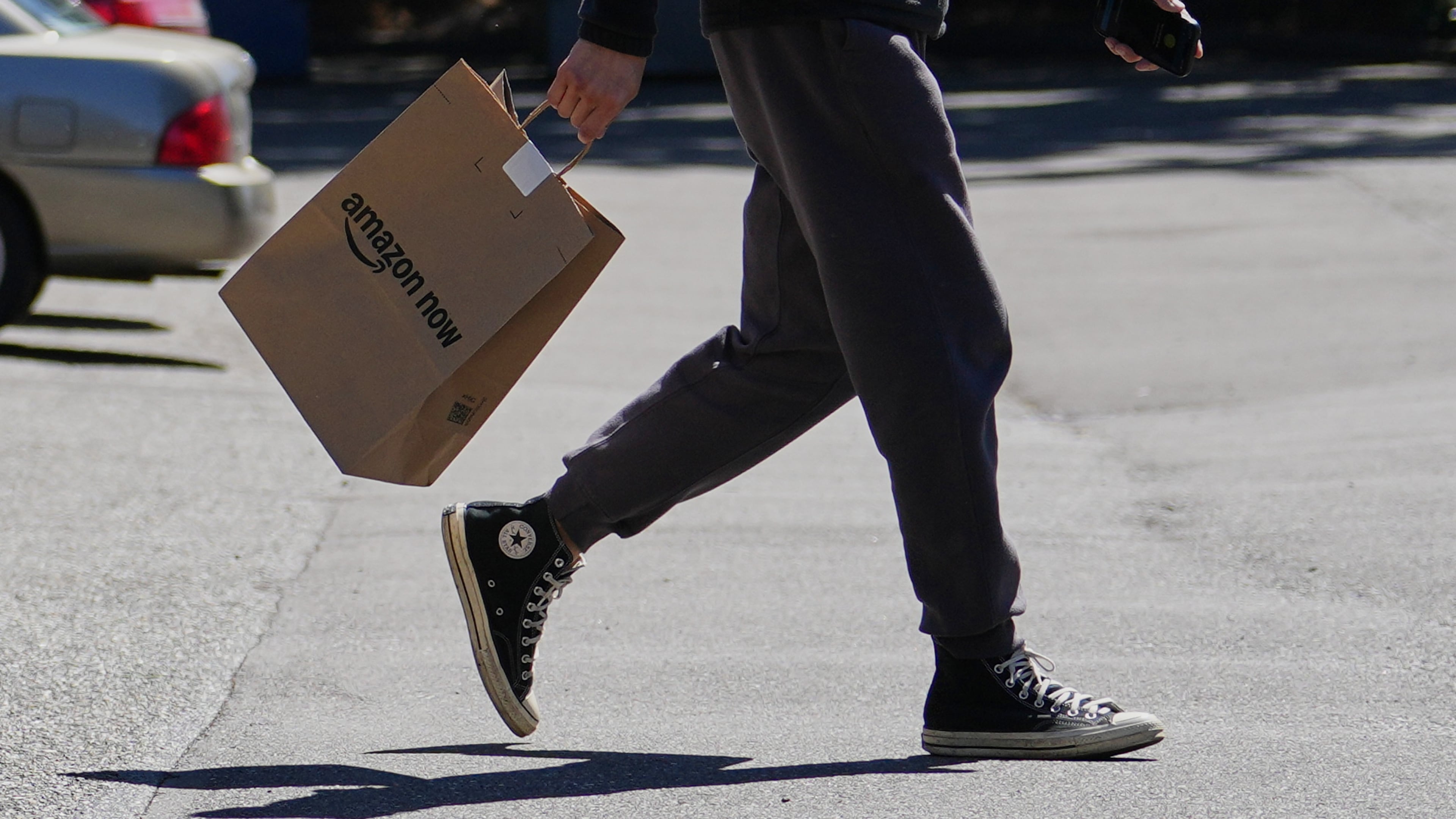 A driver picks up an order at an Amazon Now location, Monday, May 11, 2026, in Bellevue, Wash. (AP Photo/Lindsey Wasson)