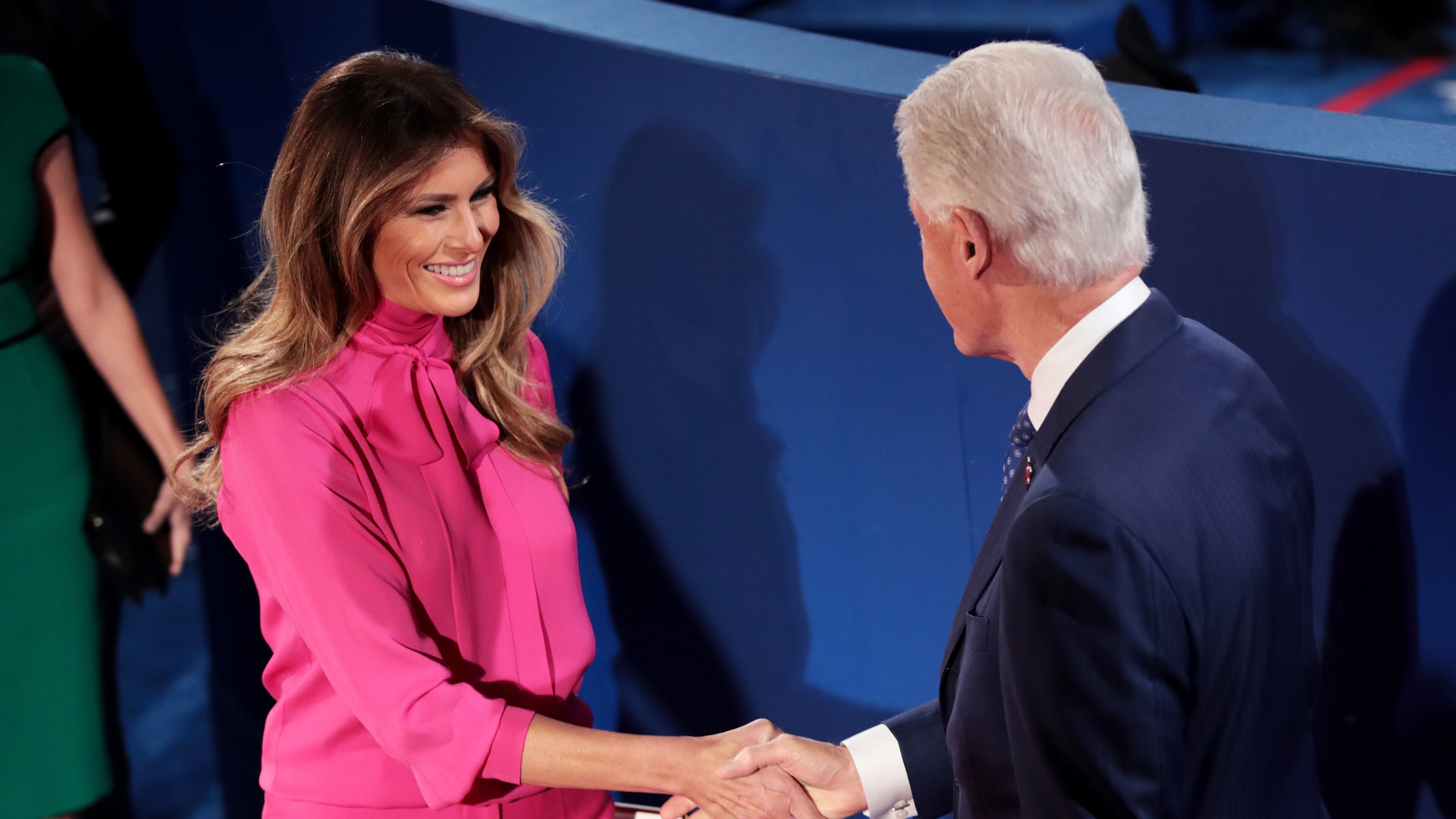 ST LOUIS, MO - OCTOBER 09: Melania Trump (L) shakes hands with former U.S. President Bill Clinton before the town hall debate at Washington University on October 9, 2016 in St Louis, Missouri. This is the second of three presidential debates scheduled prior to the November 8th election. (Photo by Scott Olson/Getty Images)