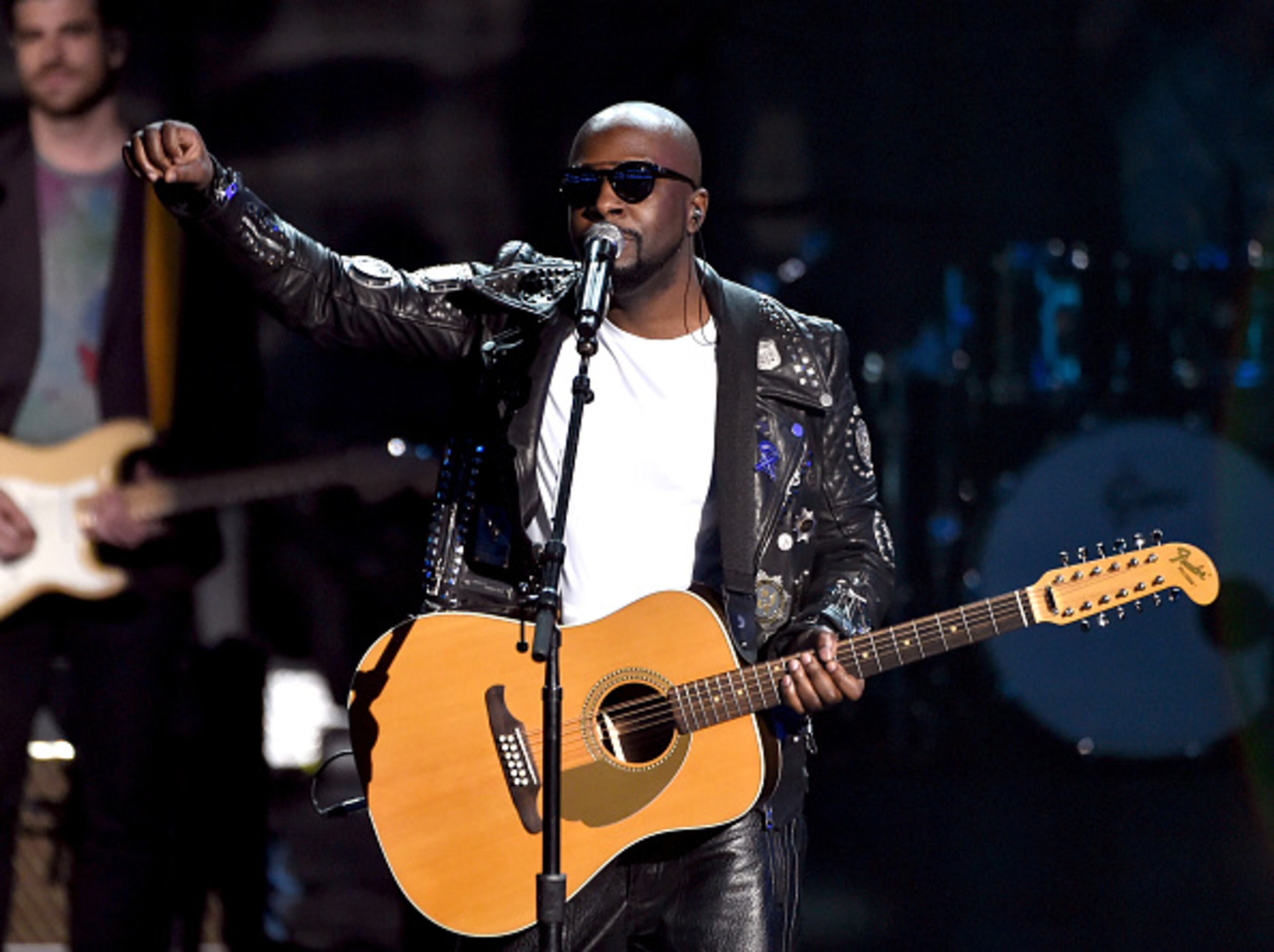 LOS ANGELES, CA - NOVEMBER 23: Recording artist Wyclef Jean peforms onstage at the 2014 American Music Awards at Nokia Theatre L.A. Live on November 23, 2014 in Los Angeles, California. (Photo by Kevin Winter/Getty Images)