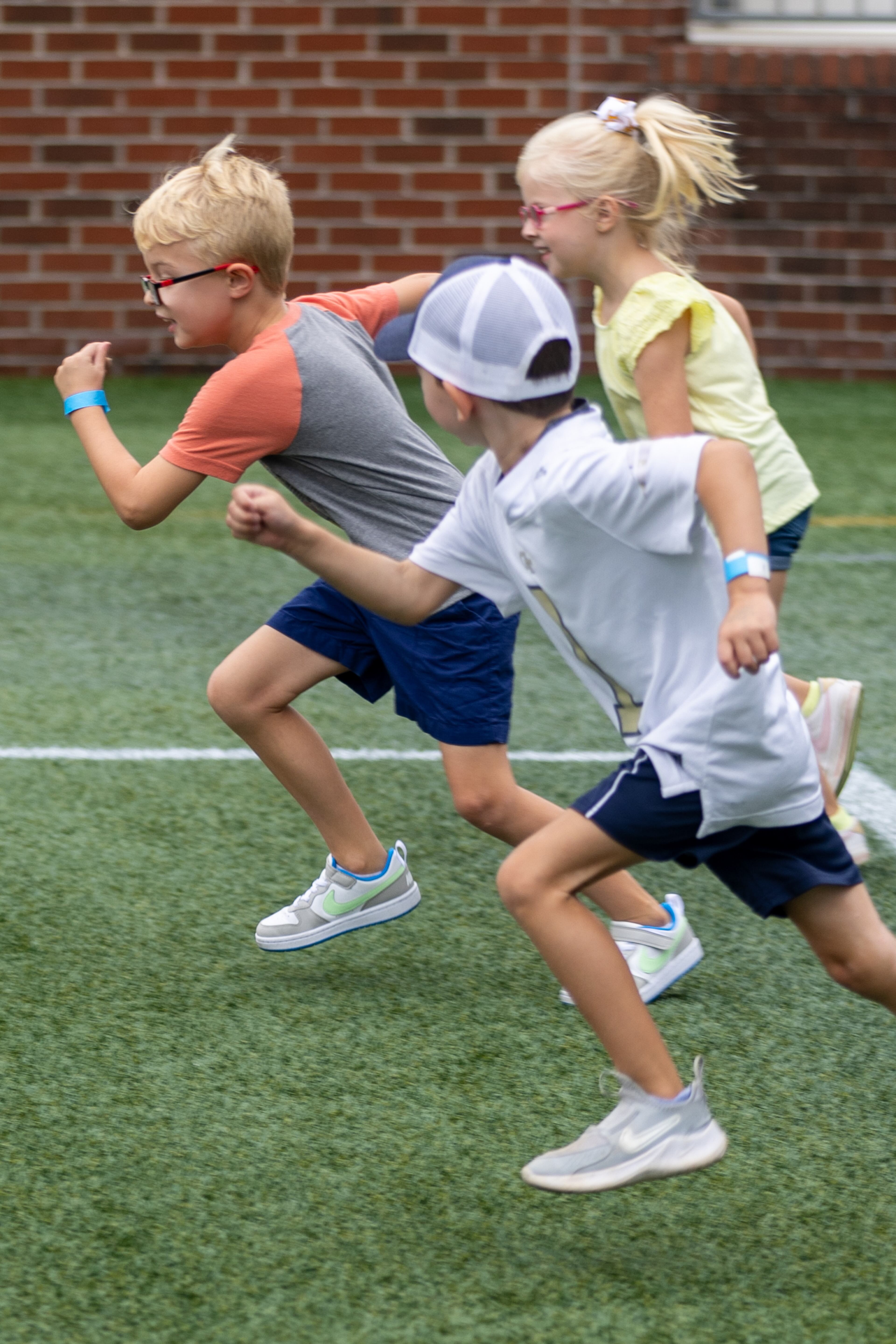 Kids run the 40-yard dash. (Steve Schaefer / AJC)