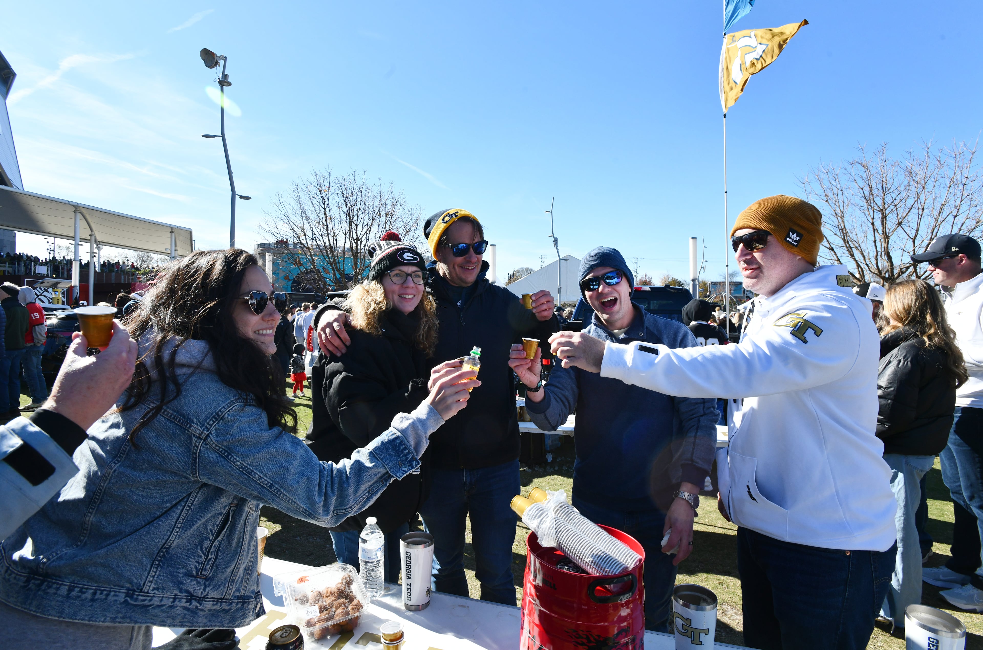 Georgia Tech and Georgia fans enjoy tailgating at The Home Depot Backyard before the start of the Georgia Tech vs Georgia football game at Mercedes-Benz Stadium, Friday, Nov. 28, 2025 in Atlanta. (Hyosub Shin/AJC)