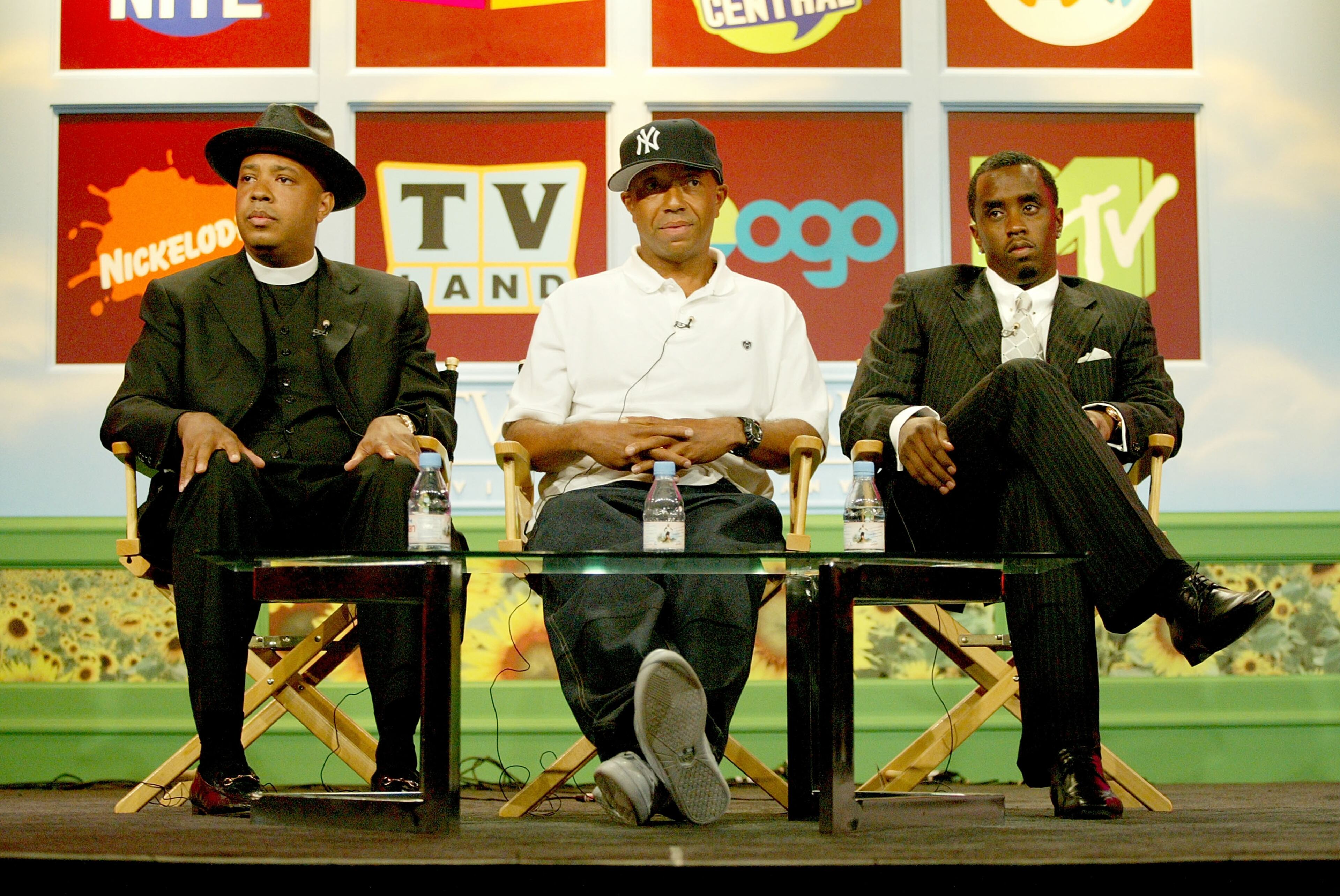 From left, Joey Simmons, aka Rev. Run of Run-D.M.C., producer Russell Simmons and producer Sean 'P. Diddy' Combs attend the MTV 2005 Television Critics Association Summer Press Tour at the Beverly Hilton Hotel on July 14, 2005, in Beverly Hills.