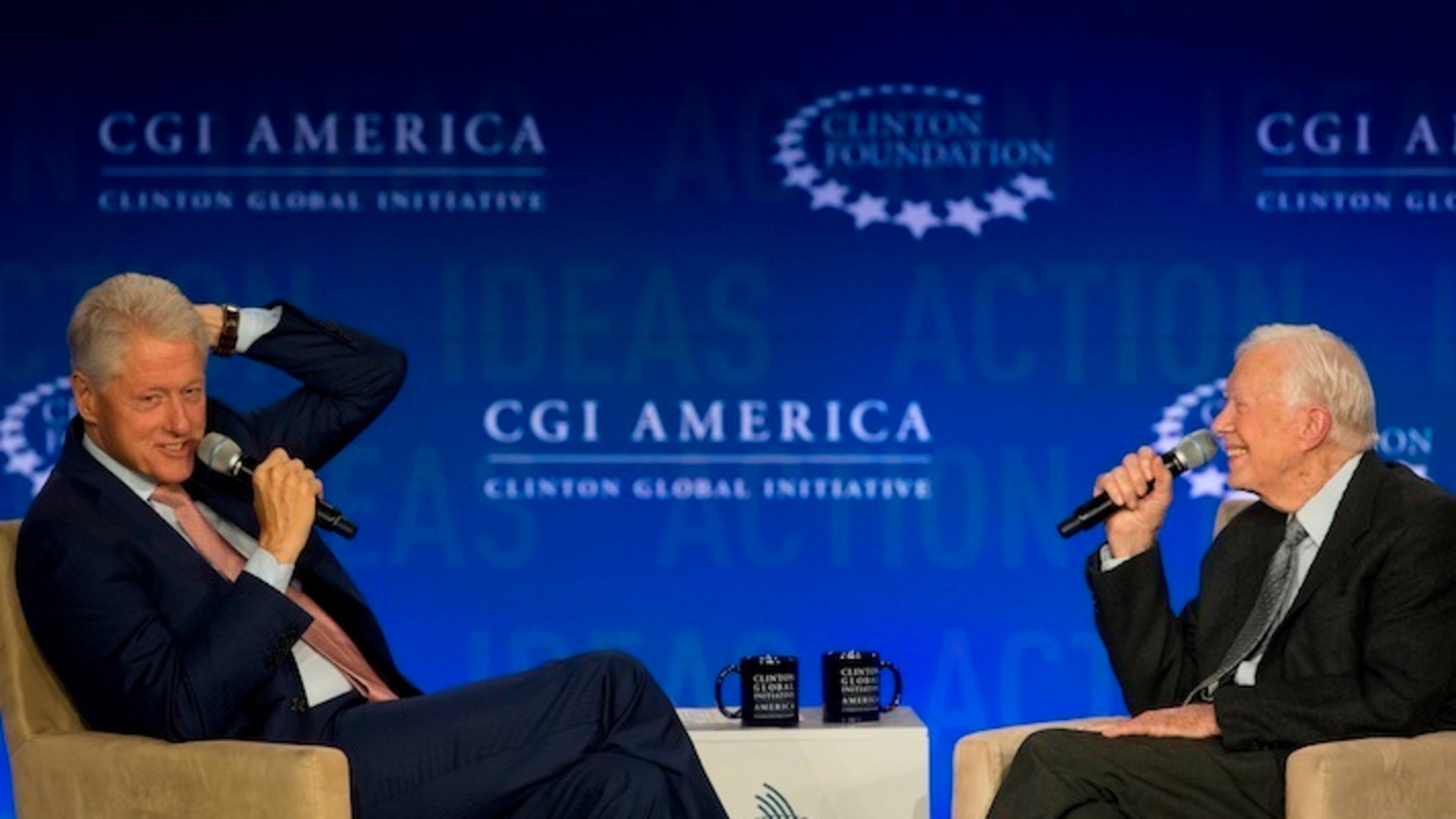 Former President Bill Clinton, left, speaks to former President Jimmy Carter during a discussion at a Clinton Global Initiative meeting Tuesday, June 14, 2016, in Atlanta. (AP Photo/John Bazemore)