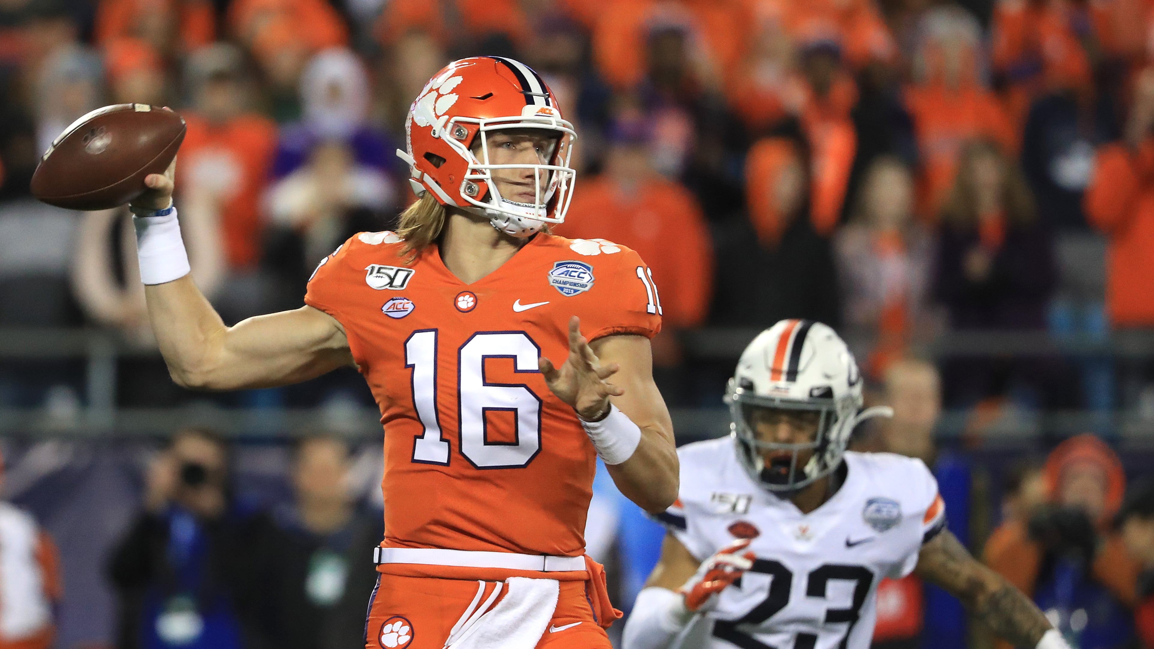 Trevor Lawrence #16 of the Clemson Tigers drops back to pass against the Virginia Cavaliers during the ACC Football Championship game at Bank of America Stadium on December 07, 2019 in Charlotte, North Carolina. (Photo by Streeter Lecka/Getty Images)