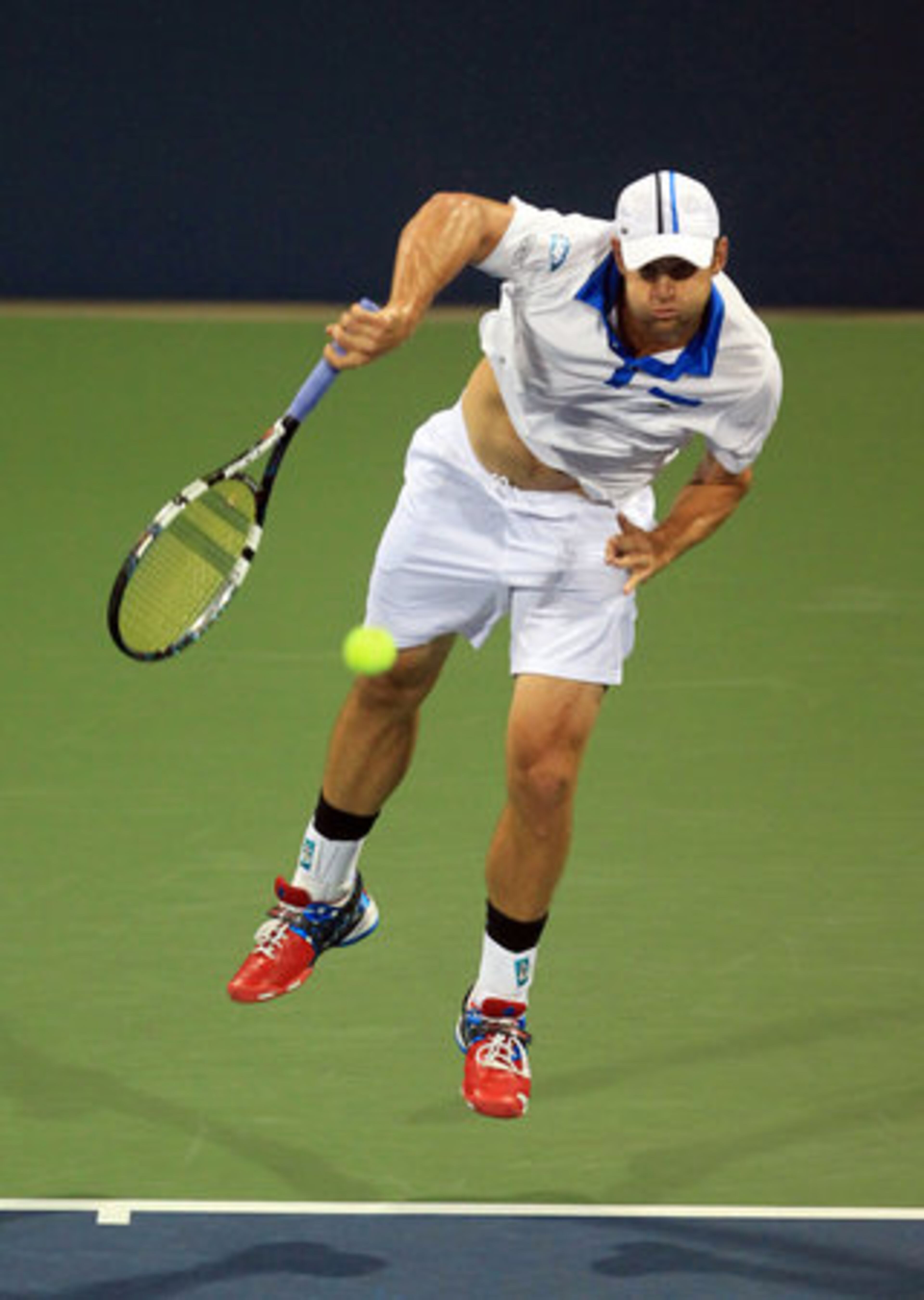 Andy Roddick, of USA, serves to Nicolas Mahut, of France, in their second round match of the Atlanta Open at Atlantic Station Wednesday night in Atlanta, Ga., July 18, 2012.