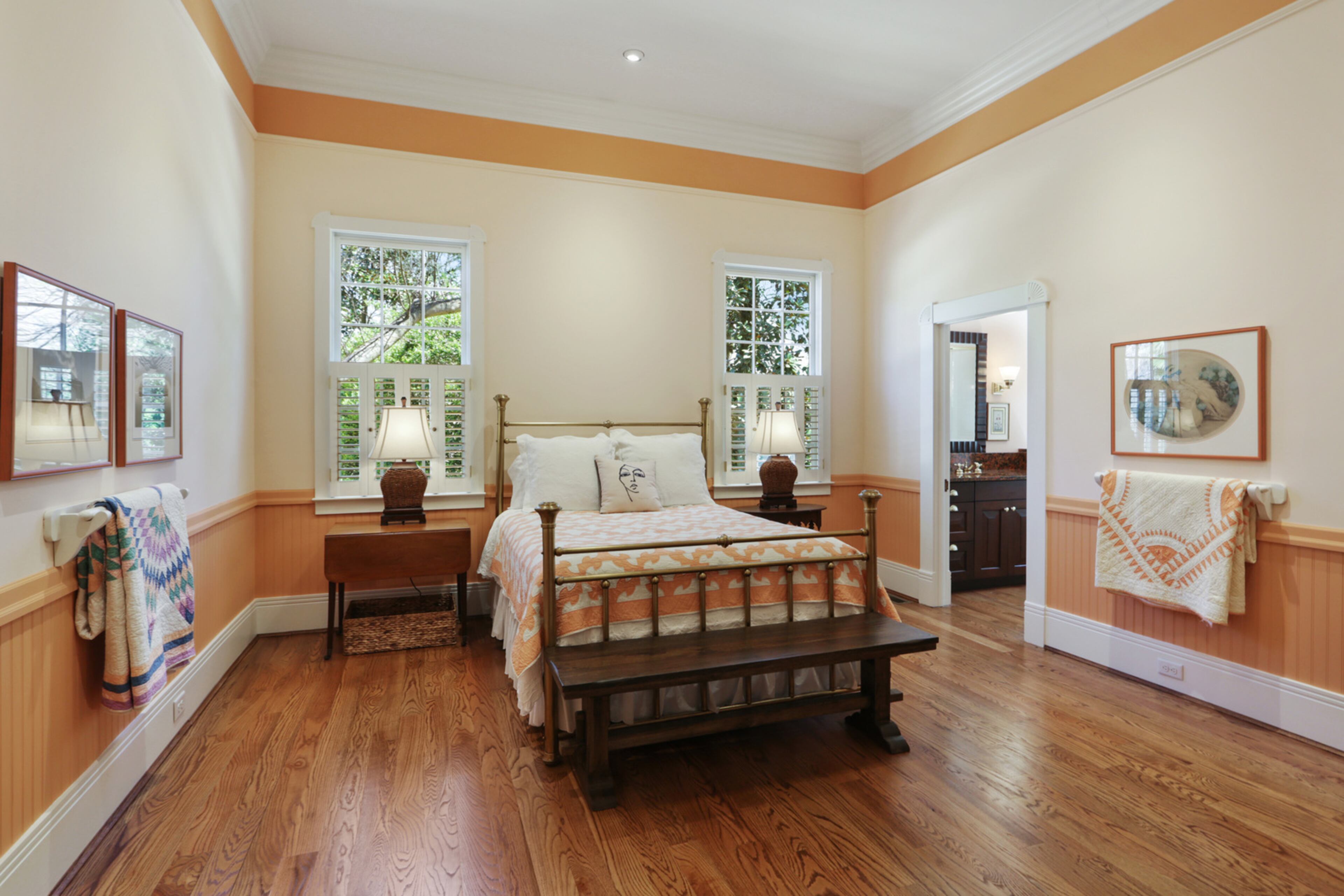 There are two spacious secondary bedrooms, each with its own walk-in closet and private bathroom. Text by Jill Huitron