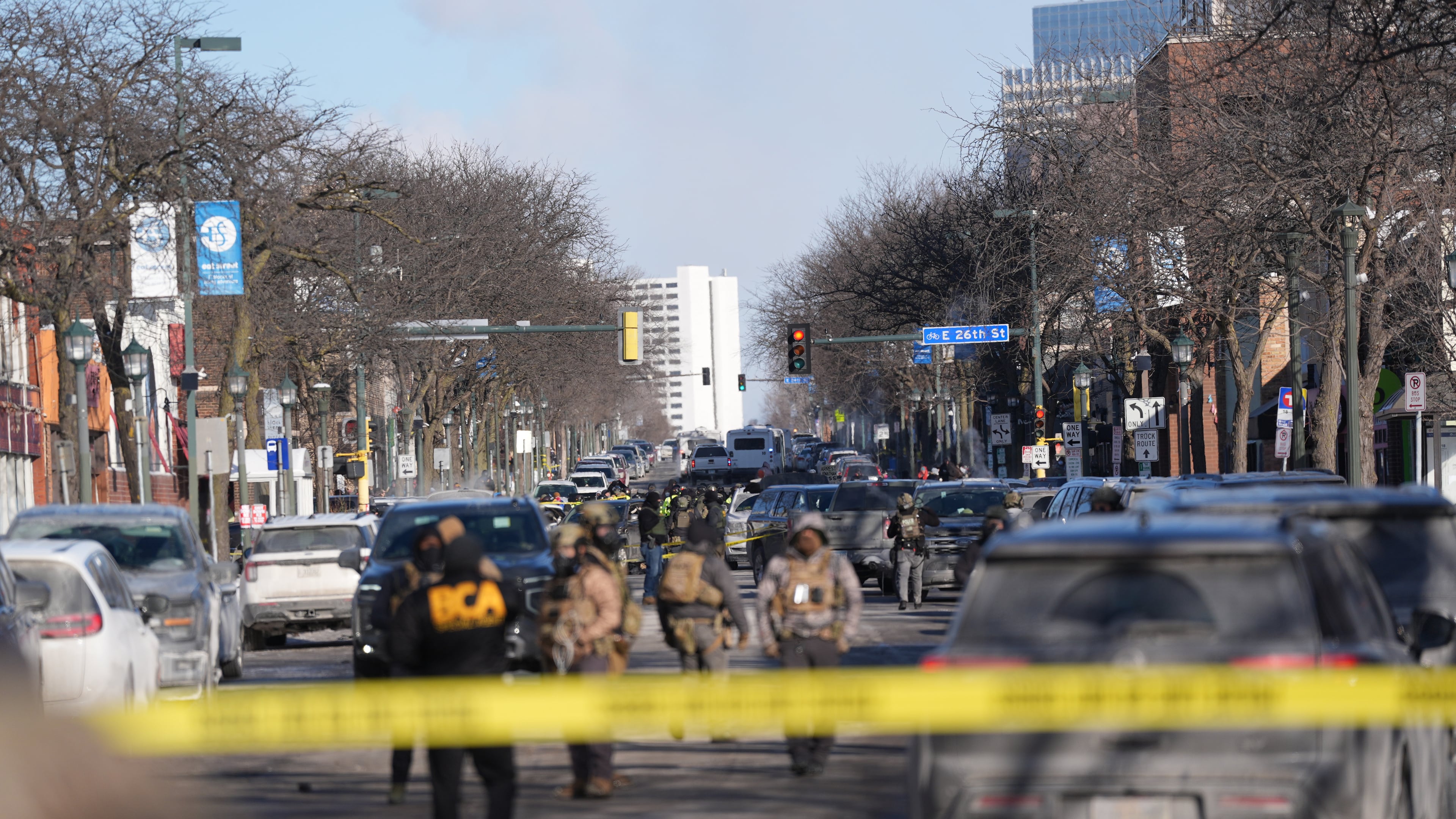 Federal agents stand near the site of a shooting Saturday, Jan. 24, 2026, in Minneapolis. (AP Photo/Abbie Parr)