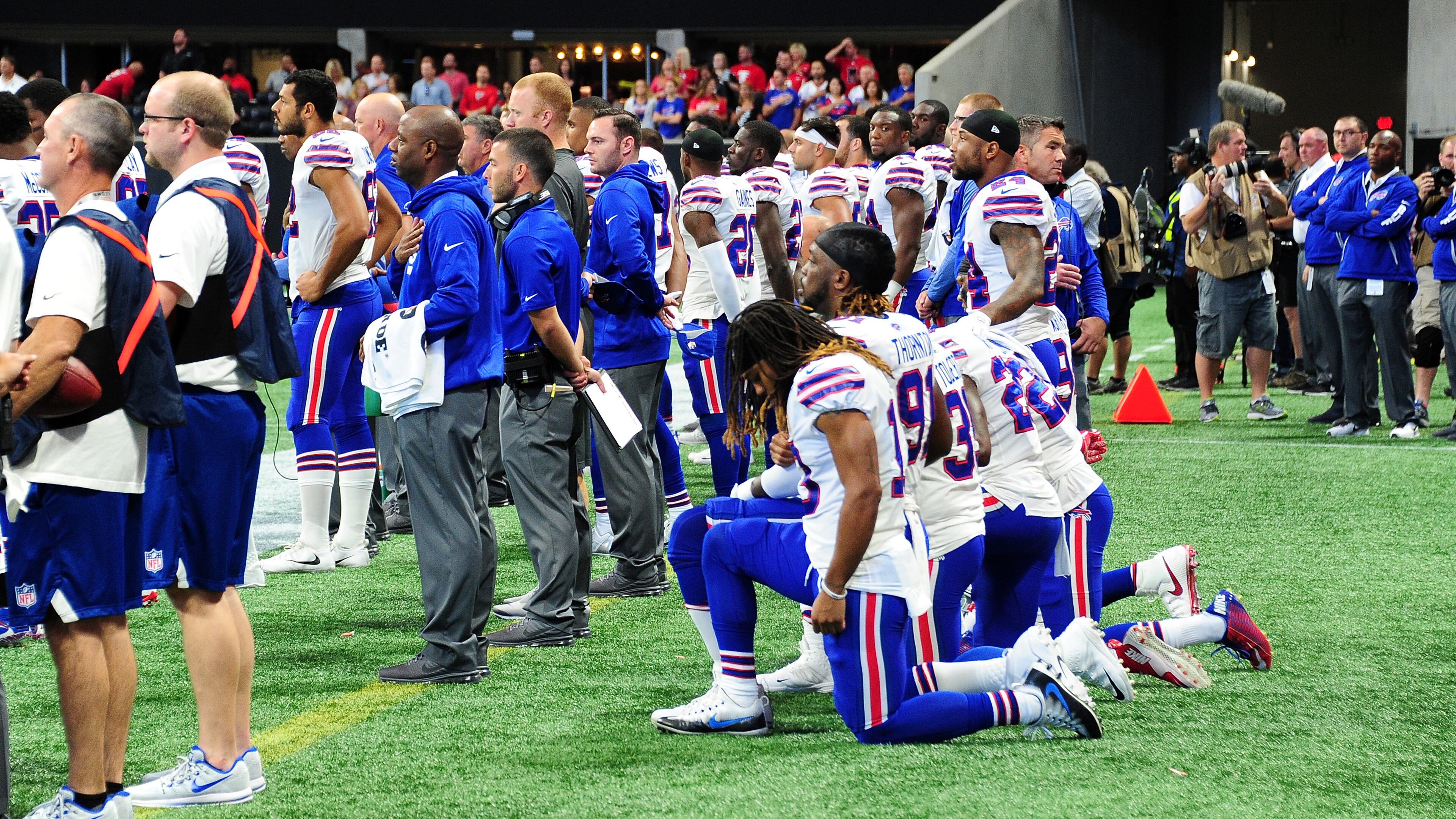 ATLANTA, GA - OCTOBER 01: Buffalo Bills players kneel during the national anthem prior to the game against the Atlanta Falcons at Mercedes-Benz Stadium on October 1, 2017 in Atlanta, Georgia. (Photo by Scott Cunningham/Getty Images)