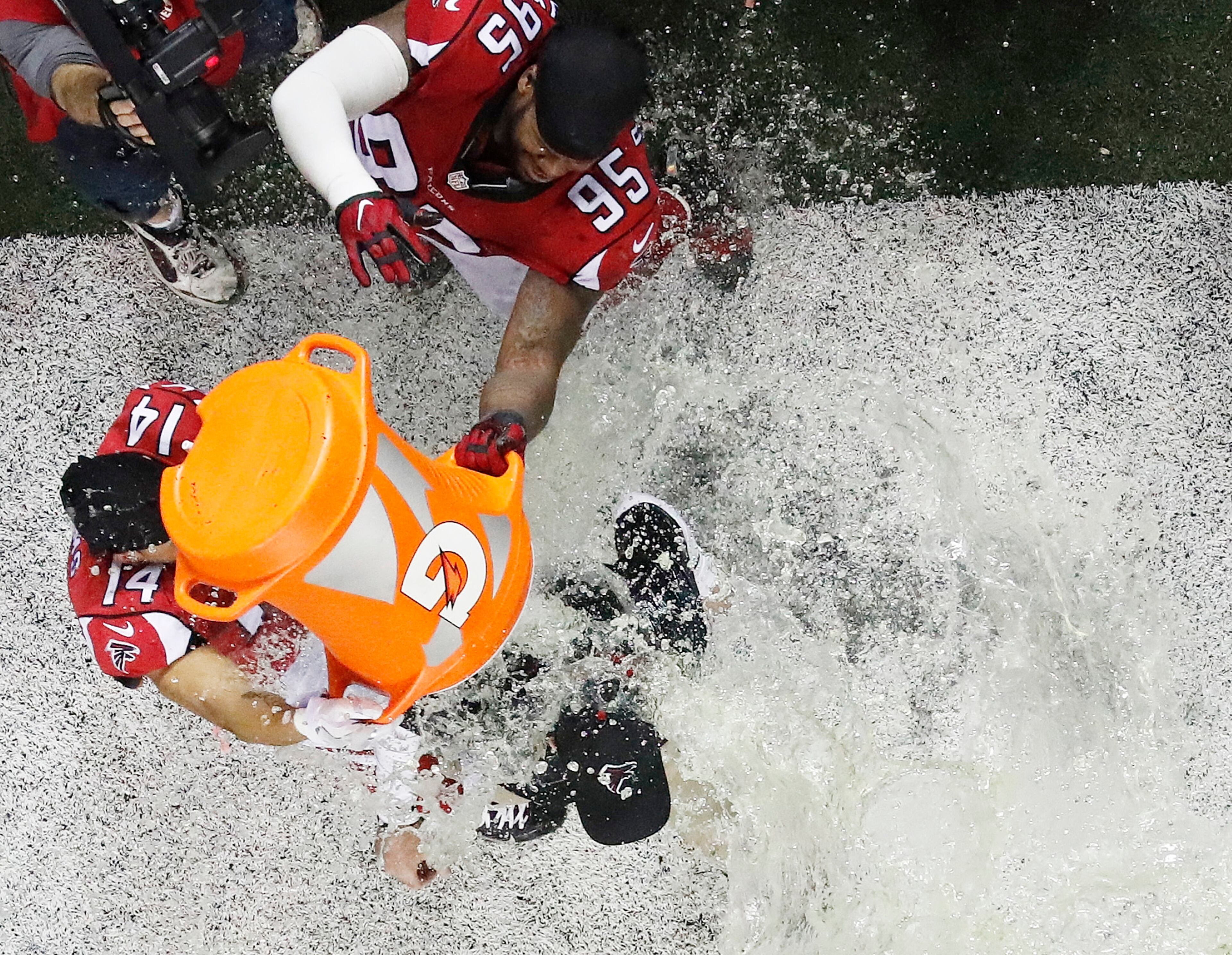 Atlanta Falcons head coach Dan Quinn reacts as he is dunked after the NFL football NFC championship game against the Green Bay Packers Sunday, Jan. 22, 2017, in Atlanta. The Falcons won 44-21 to advance to Super Bowl LI.(AP Photo/John Bazemore)