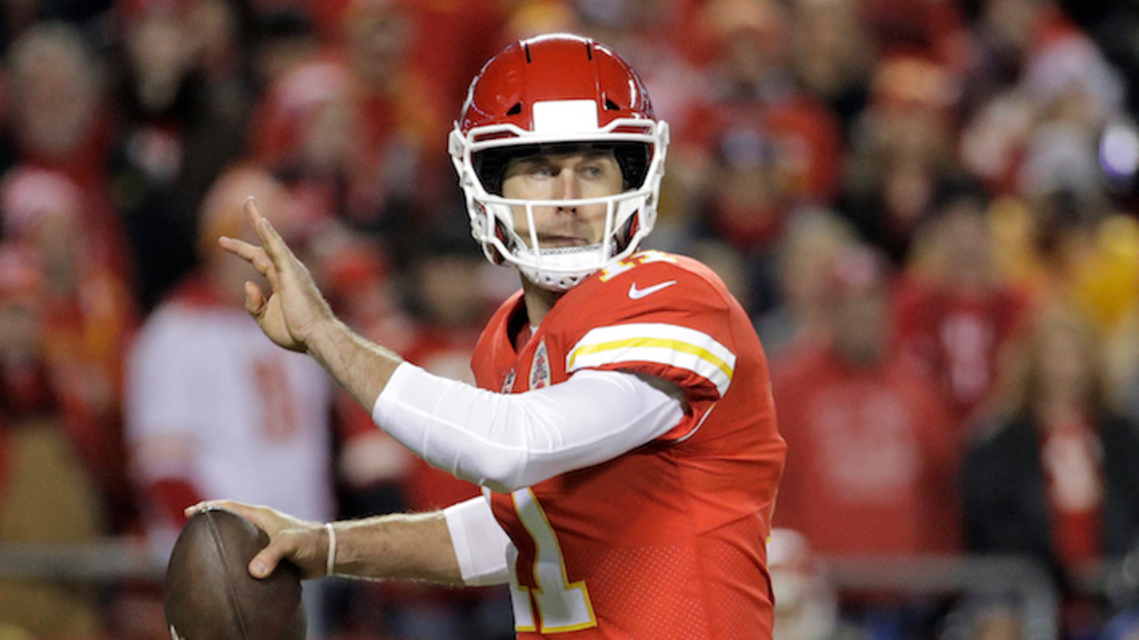 Kansas City Chiefs quarterback Alex Smith (11) looks for a receiver during the first half of an NFL football game against the Los Angeles Chargers in Kansas City, Mo., Saturday, Dec. 16, 2017. (AP Photo/Charlie Riedel)