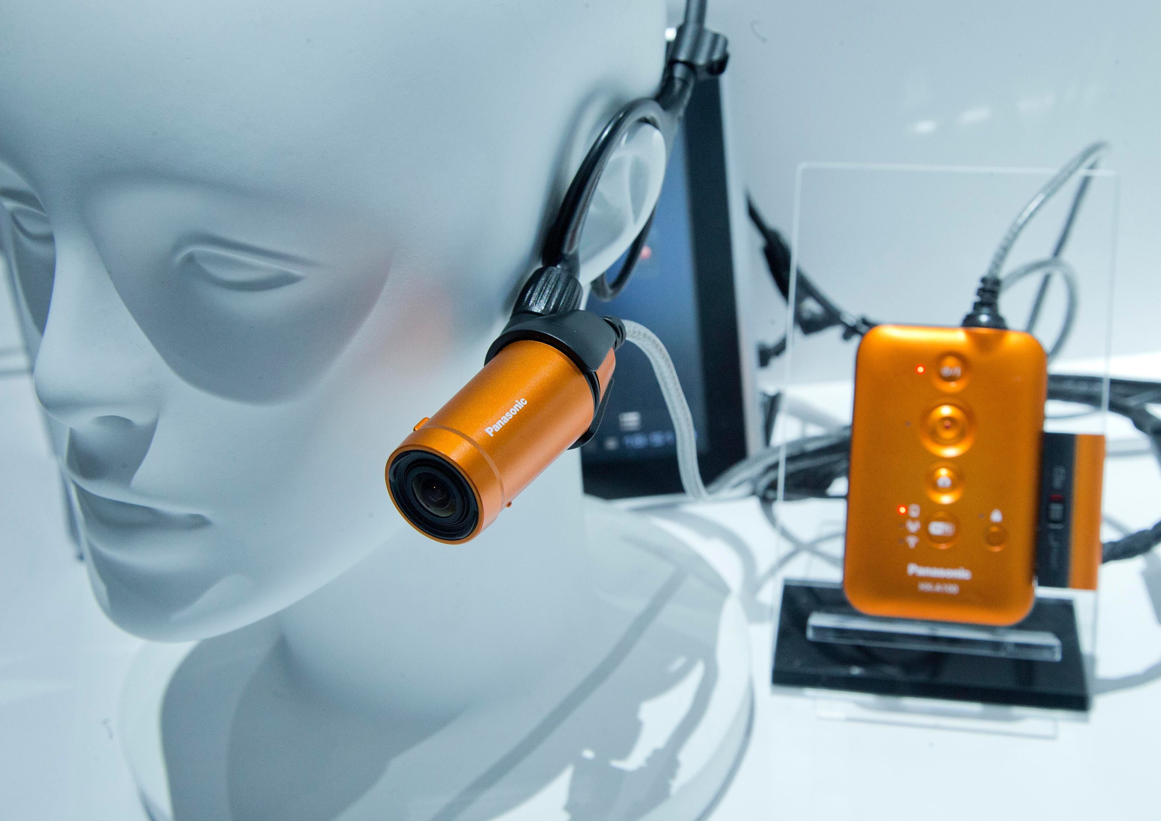 The Panasonic HX-A100 wearable wi-fi camera sits on display at the International Consumer Electronics Show, Wednesday, Jan. 8, 2014, in Las Vegas. The camera features full HD recording as well as real-time broadcasting and SMS sharing via smartphone. (AP Photo/Julie Jacobson)